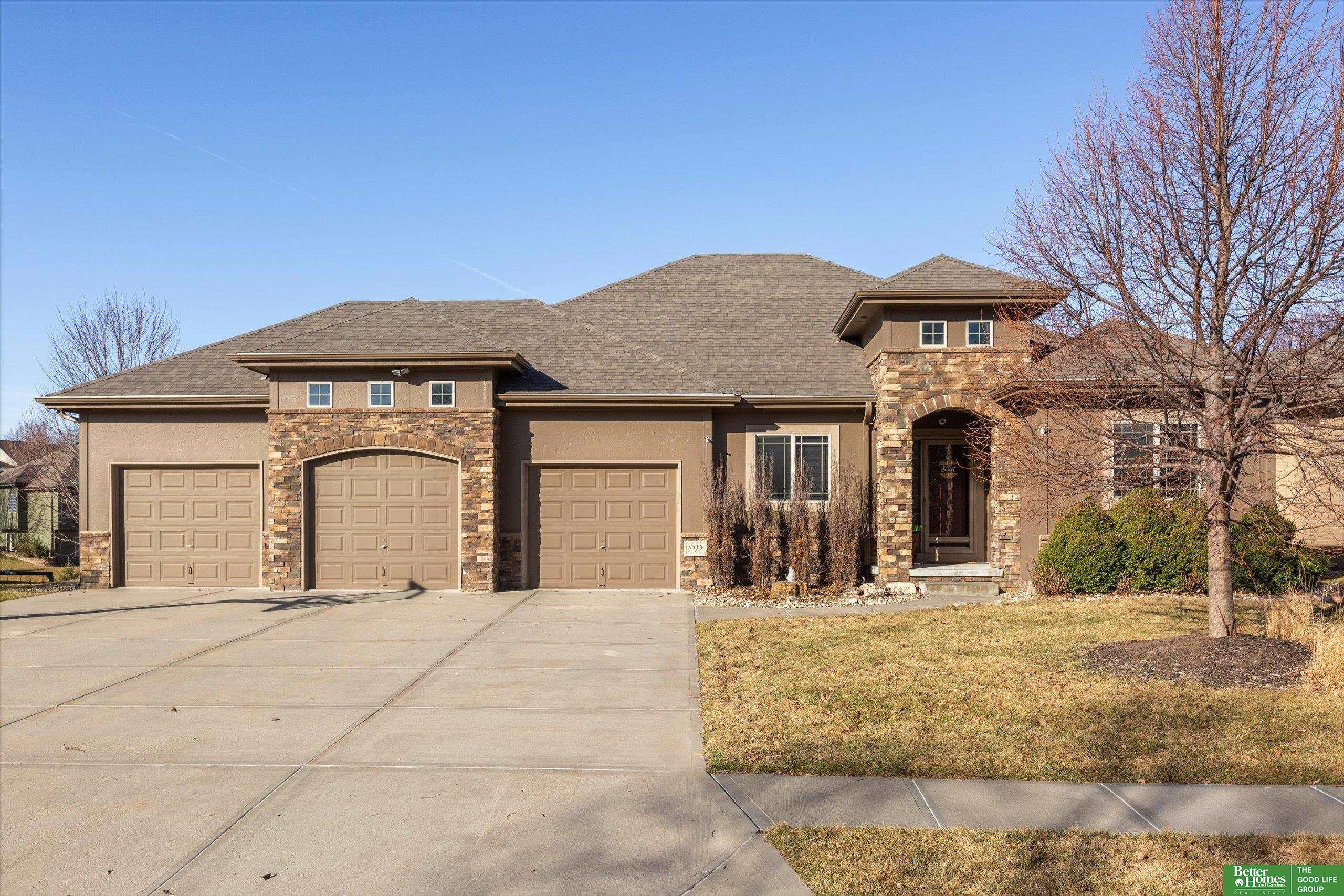 Experience a stunning departure from the ordinary! Enter through the foyer and be welcomed by wood-engineered floors that lead to the heart of the home: a freshly painted kitchen, family room, & dining area. The kitchen is ideal for cooking & entertaining, featuring a large island with extra seating, custom cabinets, a stylish tile backsplash, gas range, and spacious walk-in pantry. Just off the heated garage are custom lockers and easy access to the laundry room. Bonus features of the garage include hot/cold water spigots, sink, and floor drain. The primary suite serves as a private retreat with a walk-in closet and a full bath with dual sinks, shower, and whirlpool tub. Downstairs, discover an entertainer's paradise with a spacious recreation room, an 2nd kitchen/wet bar, & theater room. Step outside to a stamped concrete patio with built-in high-top seating around a gas firepit, sure to impress your neighbors.  The home is also equipped with security cameras & new roof in 2024.