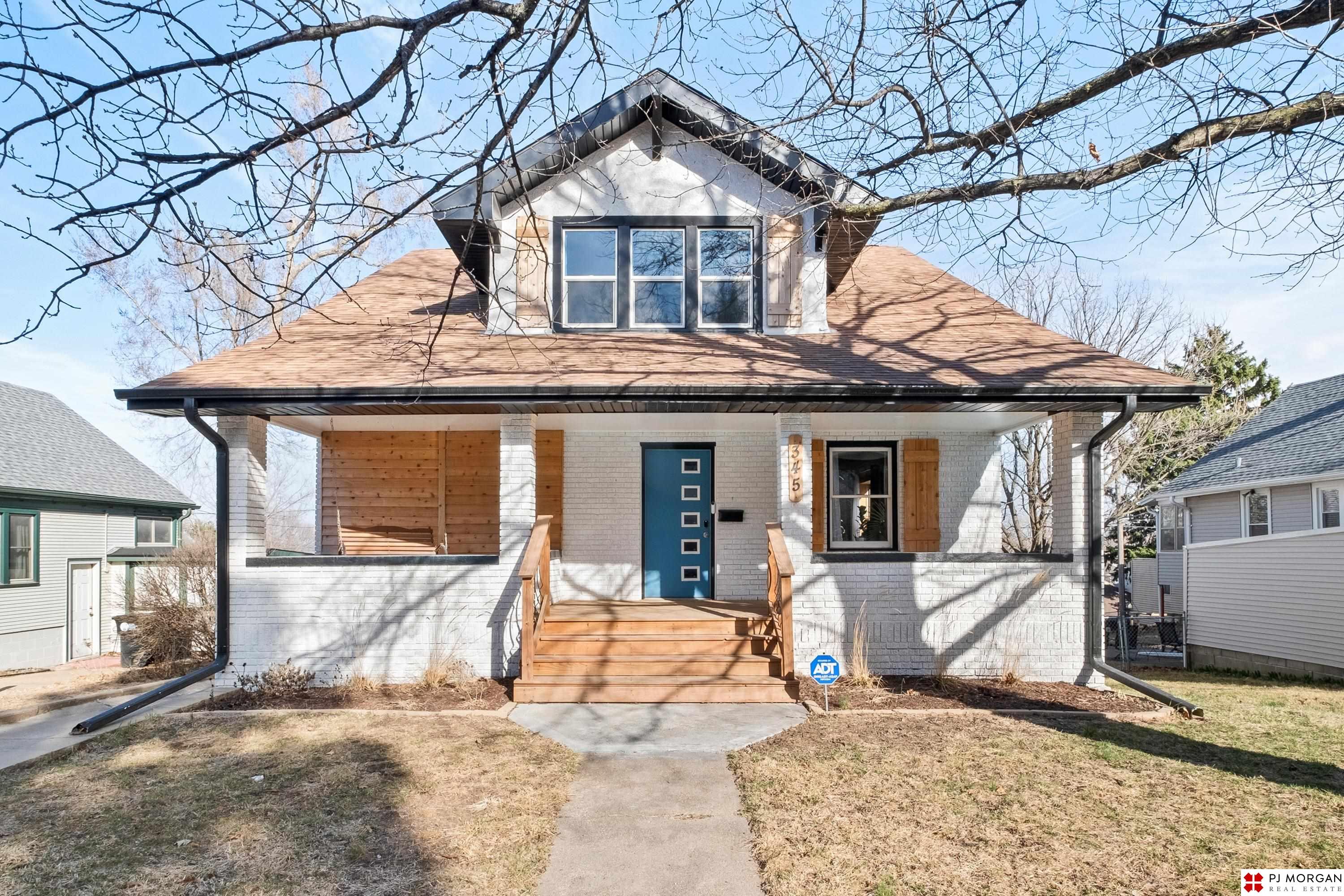 Showings begin Wednesday 3/26. This is THEE one in Midtown! Over 3,000 sq ft, 5 bed, 4 bath, with tons of updates done between 2022–2025. Massive front porch with swing sets the tone—classic Midtown charm with tasteful modern updates. Smart home tech with Nest thermostat + smart locks. Main floor is bright and open with a dedicated dining space, office, and tons of natural light from oversized windows. Beautiful updated kitchen with ample quartz countertop space, updated hardware, and great flow for entertaining. The primary suite features a gorgeous updated bathroom with walk-in shower and high-end finishes. Walkout basement includes a full kitchen, washer/dryer, bedroom + bath—perfect for MIL suite, Airbnb, rental, or entertaining. Huge back deck with downtown Omaha views. Sellers invested big on maintenance: new HVAC, electrical panel, plumbing, landscaping, driveway/sidewalk concrete, retaining wall + more. Minutes from Dundee, Blackstone, Midtown, and Downtown. AMA.