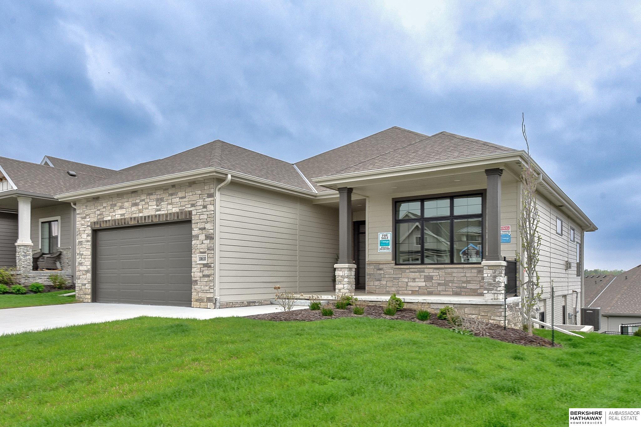 "The Harper" presents a new floor plan featuring an open concept design, a 10' center island, a floor-to-ceiling stone fireplace, and a prime cul-de-sac location. Meanwhile, "The Cove" is a high-end villa community situated within a gated area, adjacent to scenic walking trails, a park, and a vast 135-acre recreational lake. Enjoy a maintenance-free lifestyle with no more mowing or shoveling. Now waiting for its new owner. Open Saturday and Sunday 1-3pm.  Go to 10620 S 127th to have agent let you in.