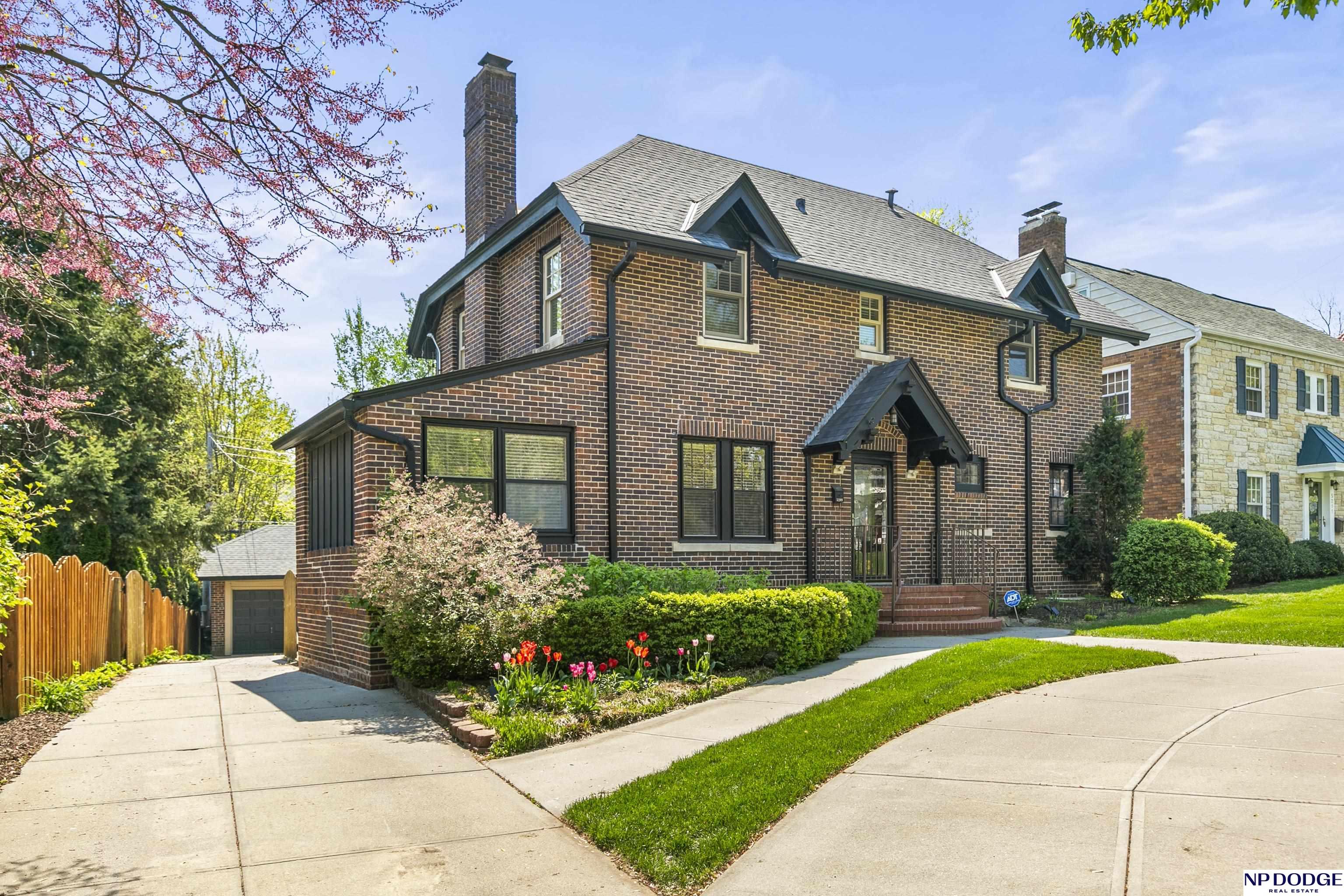 Stunning All-brick Dream Home in Happy Hollow! Meticulously remodeled with old-world charm and modern updates. Rare main floor primary bedroom. 4 beds, 4 baths, 2 laundry areas. Fantastic lower level with 2 non-conforming bedrooms. Oversized deck overlooks private, park-like backyard. Convenient circular driveway. Super-rare find! AMA