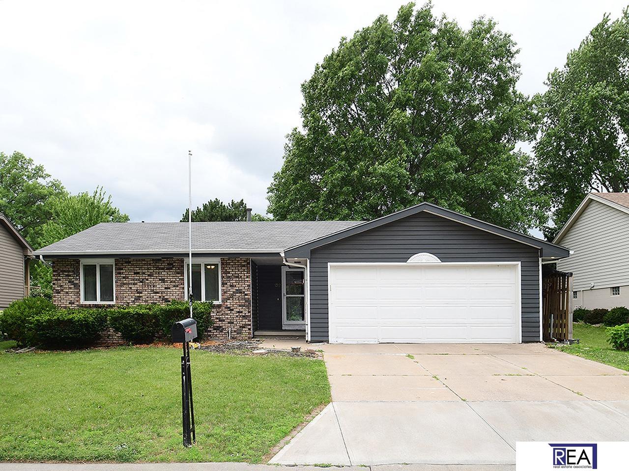Now accepting FHA and VA, this 1978 ranch-style home which includes 3 bedrooms, 3 baths, and 2-car garage is nicely situated in a peaceful cul-de-sac in the desirable Eldorado neighborhood. This home offers tremendous potential to investors or enterprising home buyers who are willing and able to invest in some serious TLC and renovation. Main floor hosts a cozy family room with a lovely view of the back yard and common area, eat-in kitchen, and 3 bedrooms with 3/4 bath in primary. Home features newer HVAC and water heater. The backyard abuts to a common area and ideal for both play and privacy. Finished basement boasts a large bonus room that could be a 4th bedroom if egress added, 1/2 bath, spacious storage room with laundry (W/D included), wet bar, a stone FP for cozy nights and a large rec room for family gatherings/game days. Well located in the Millard school district and close to Dodge Expressway, shopping, dining, etc. Home has great possibilities--see it for yourself! AMA.