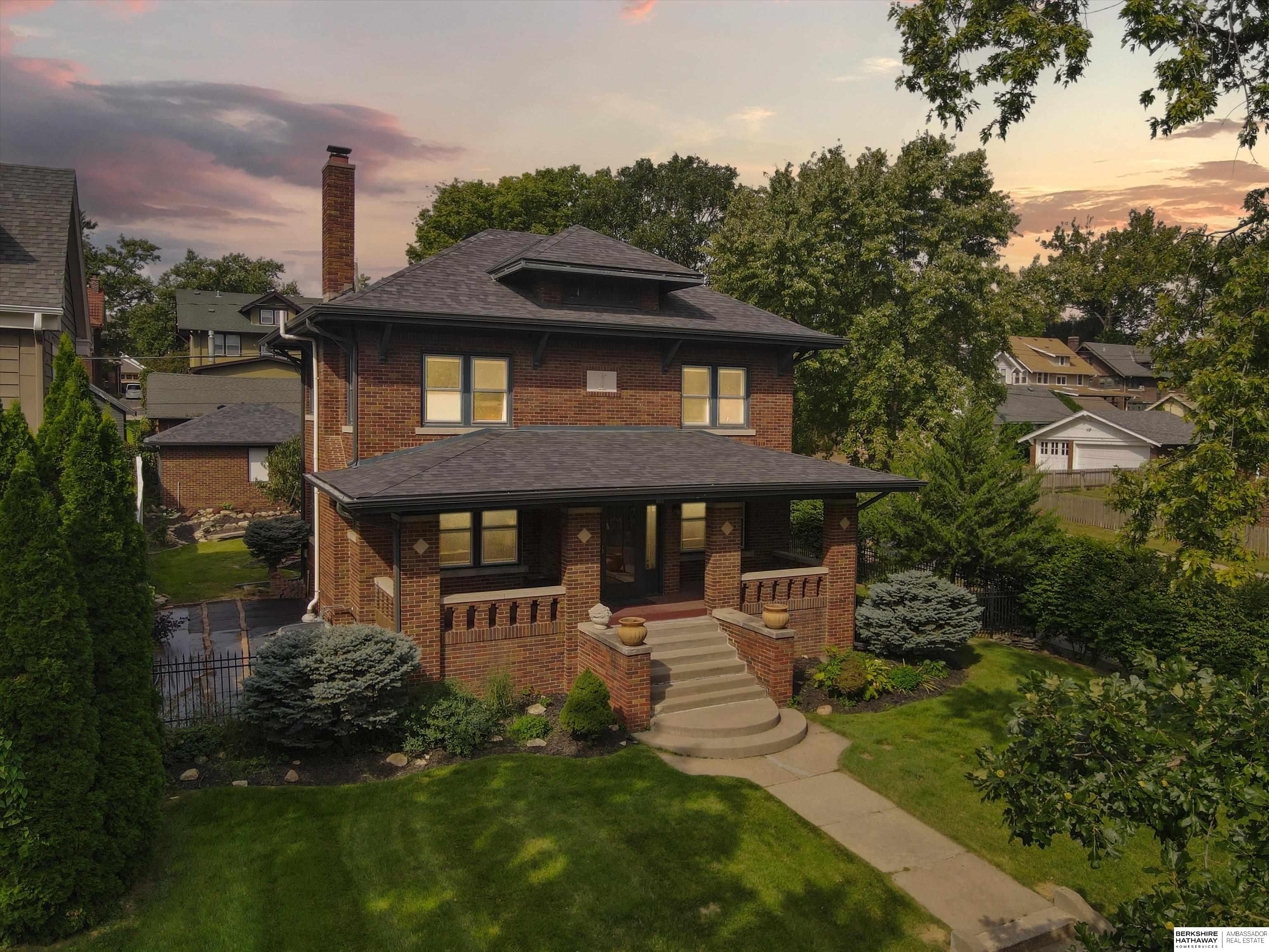 In the heart of Dundee, this historic all brick home sits high and sightly on a large corner lot. Beautifully updated, all while keeping the charm desired in a midtown home: gorgeous original hardwoods throughout, huge covered front porch, original fireplace, built-in library wall & mature landscaping. Newer chef's kitchen w commercial refrigerator, granite counters, stainless, updated cabinetry and coffee bar. Large dining opens onto living area w bonus library and guest bath on main floor as well. Huge 2 car garage & meticulously landscaped, private fenced backyard. Four beautiful sunlight filled bedrooms upstairs are a bonus. Finished lower level w second fireplace, 5th bedroom, another full bathroom & large cedar closet. The walkability- to dining, hot spots and entertainment- of this location is second to none. Too many updates and improvements to list including newer high end windows: owner has been an impeccable steward of this showstopper home & pre-inspected for peace of mind.