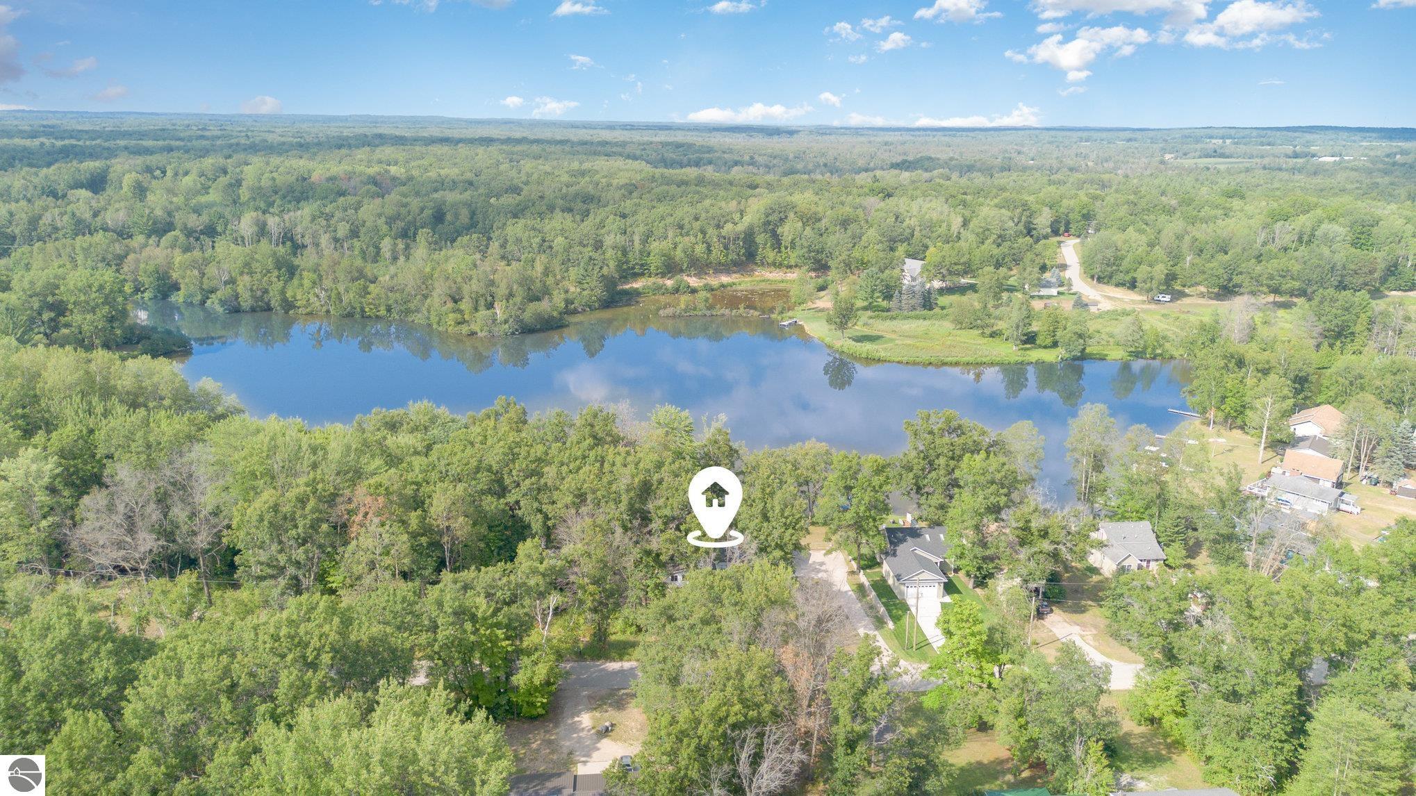 Two of the few waterfront lots available on this excellent fishing lake. 110' of frontage on Lake of the Hills. Great neighbors and a lot of community spirit.  Close to the local sporting goods and bait shop.   Short-term land contract available with large down payment. Small shed on the property. 1/2 acre of land. Some mature hardwoods.  Paved Road. Cable internet. 5 minutes to Weidman and 20 minutes to Mt. Pleasant. Quiet and peaceful. Get away from it all.