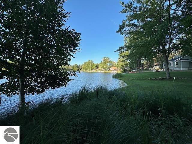 Two of the few waterfront lots available on this excellent fishing lake. 110' of frontage on Lake of the Hills. Great neighbors and a lot of community spirit.  Close to the local sporting goods and bait shop.   Short-term land contract available with large down payment. Small shed on the property. 1/2 acre of land. Some mature hardwoods.  Paved Road. Cable internet. 5 minutes to Weidman and 20 minutes to Mt. Pleasant. Quiet and peaceful. Get away from it all.