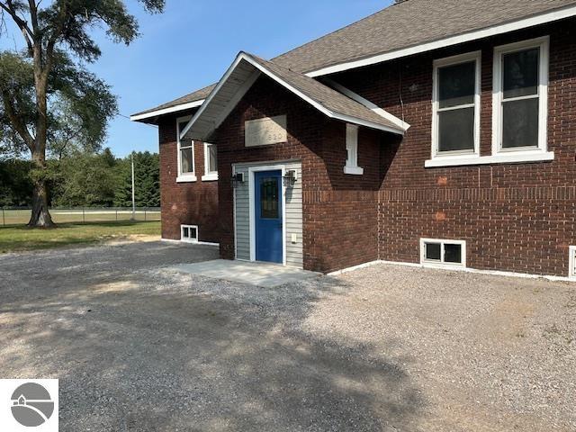 Featured in the 2025 Parade of Homes, this historic township hall was recently transformed into a single family home and everywhere the accent is on space. One acre yard outside. 12-foot ceilings inside. 2000 sq ft on the main floor. 2000 sq ft in the lower level. Three giant bedrooms. A great room. One and a half baths. Beautifully updated for stylish living. Freshly painted. Bamboo flooring throughout. Front entry foyer. Central air. Spacious eat-in kitchen. All kitchen appliances included. There is room to grow with lower level bonus rooms each measure 23' x 30' x 8.5' that are partly finished. Furnaces new in 2023. 5'' well. This property is fenced on the west and north sides. Ramped/No step entry on the west. Great location just 3 miles east of Blanchard. Adjoins beautiful Payden Park. One-of-a-kind property for a one-of-a-kind person!