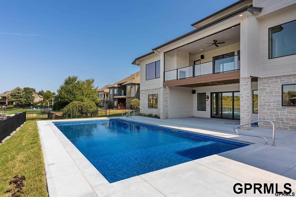 No dollar was spared in this luxurious, custom-built Modern Farmhouse by Maxim Homes. This 1.5 story living boasts an abundance of natural light and open concept living at its finest. The kitchen features SS appliances, an oversized island, walk in pantry and steps away from the generous mud room. Main floor offers primary suite that provides functional beauty with a spa like retreat bath, large walk-in closet and easy access to laundry along with 2nd bedroom/office. 2nd level offers 2 spacious bedrooms and a full bath.The covered upper deck provides a fireplace and gorgeous views for outdoor entertaining. Lower level is an Entertainers dream with movie theater, bar area, 5th bedroom, full bath and a second laundry. Oversized 4 Car garage has ample storage area. The backyard with stunning pool, unbelievable views and privacy perfectly rounds out this stunning home in Blue Sage Creek.