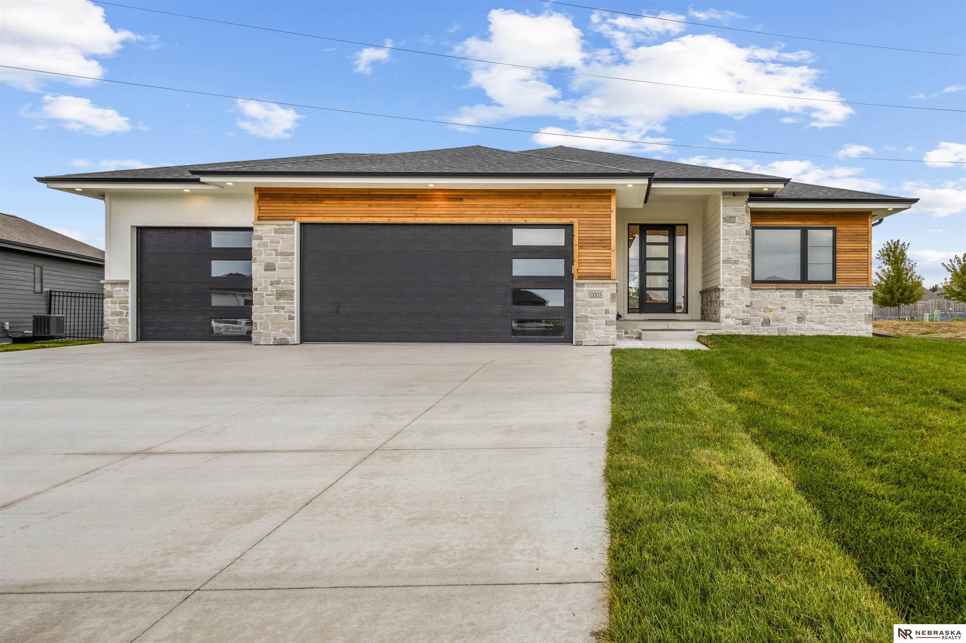 Builder is offering a $5,000 Buyer Credit!! Welcome to this beautifully maintenance-free home located in Bridgeport. This 4-bedroom, 3-bathroom home features a 3-car garage and a fully finished basement. Enjoy high-end finishes throughout, tall ceilings, custom features, large windows that fill the home with natural light, and a stunning kitchen perfect for entertaining. Downstairs, you will find a bright and inviting space ideal for entertaining or a second living area; featuring 2-bedrooms and a full bathroom, there's plenty of room for family, guests, and even a home office. Step outside to the covered patio, perfect for enjoyment. Additional features include underground sprinkler for easy maintenance. The HOA provides true low-maintenance living, including lawn care, snow removal, trash service, and access to the neighborhood pool and trails.  Don’t miss this exceptional opportunity brought to you by Nebraska Dream Home Builders!