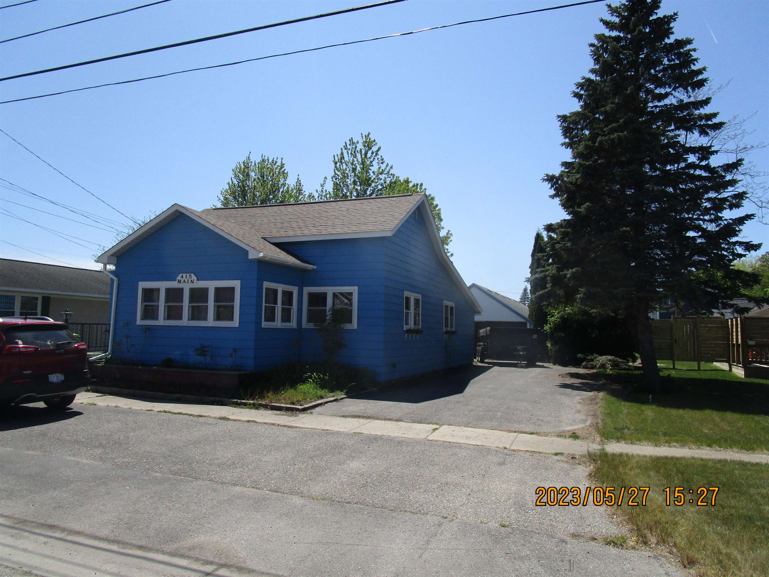Location Location This 2 bedroom 1 bath home is blocks from Lake Huron. Has a large garage and a studio type apartment for over flow or will generate rental income. Please understand, pictures were taken in the moving process.
