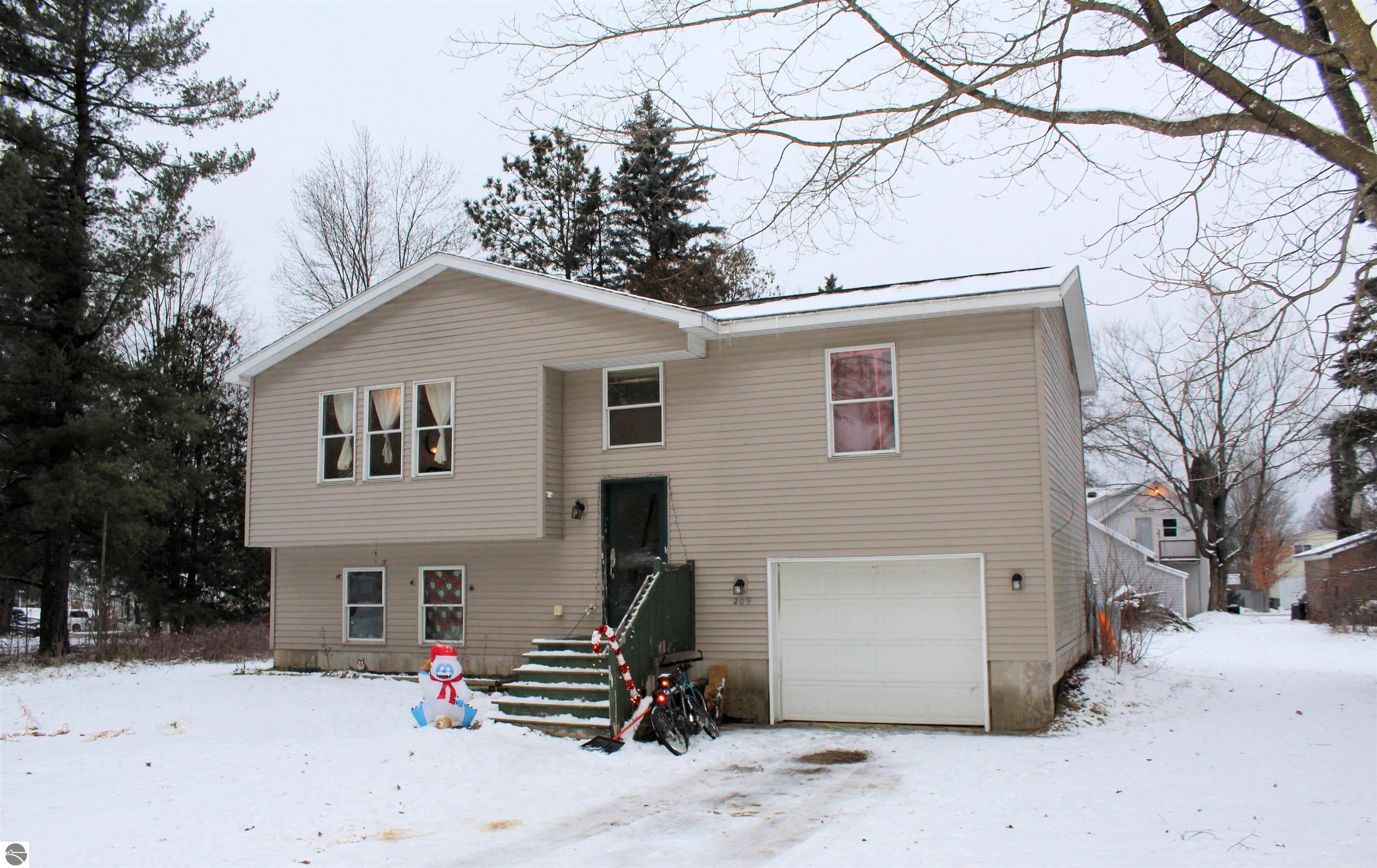 209 E Michigan, Mancelona, MI 49659 — front exterior