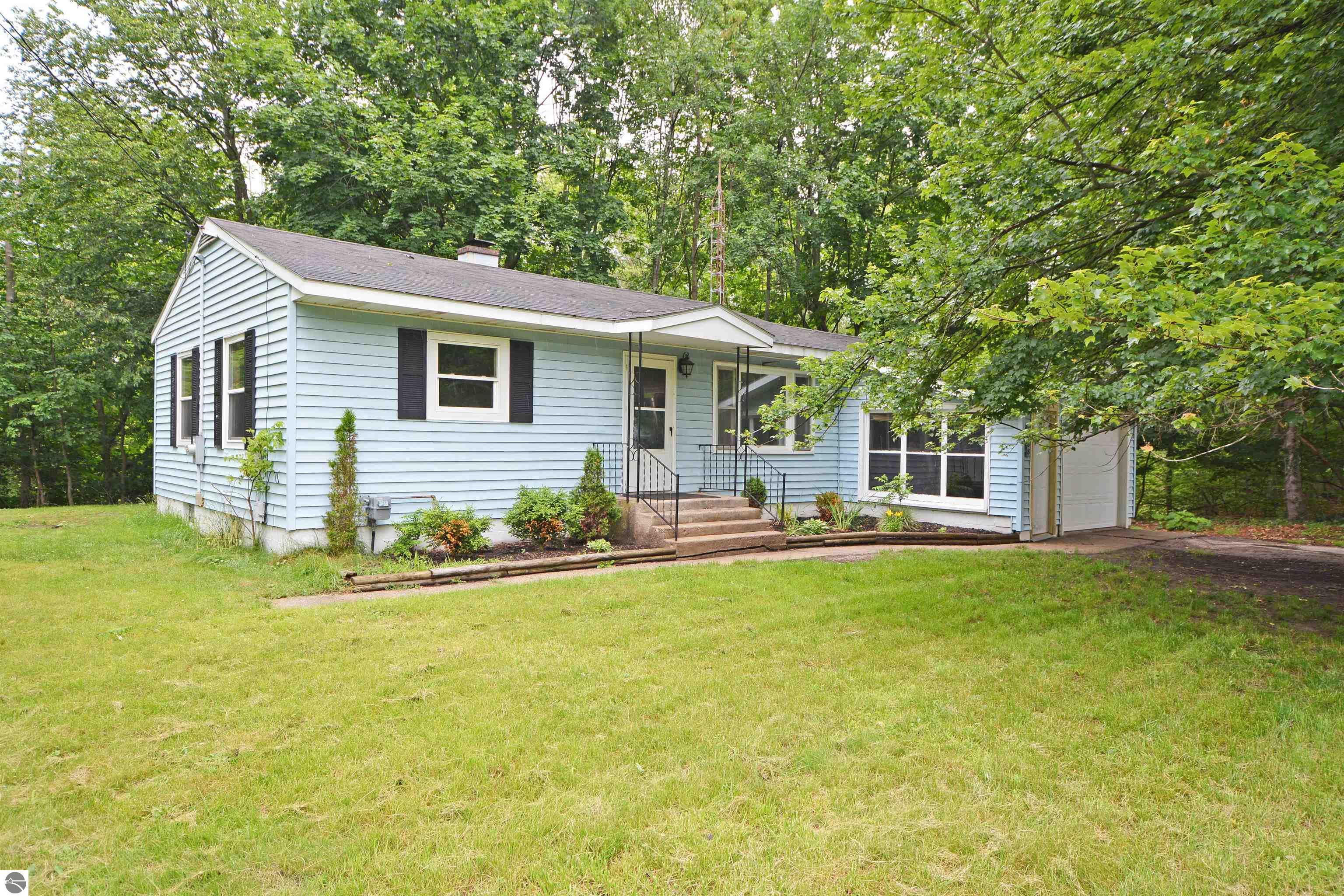 8388 Leecrest Boulevard, Onekama, MI 49675 — front exterior