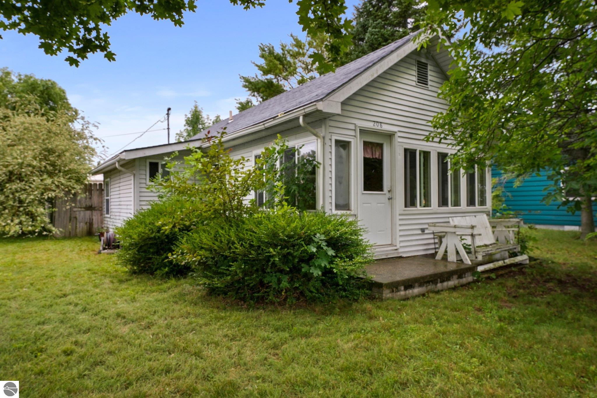 208 Lake, Elk Rapids, MI 49629 — front exterior