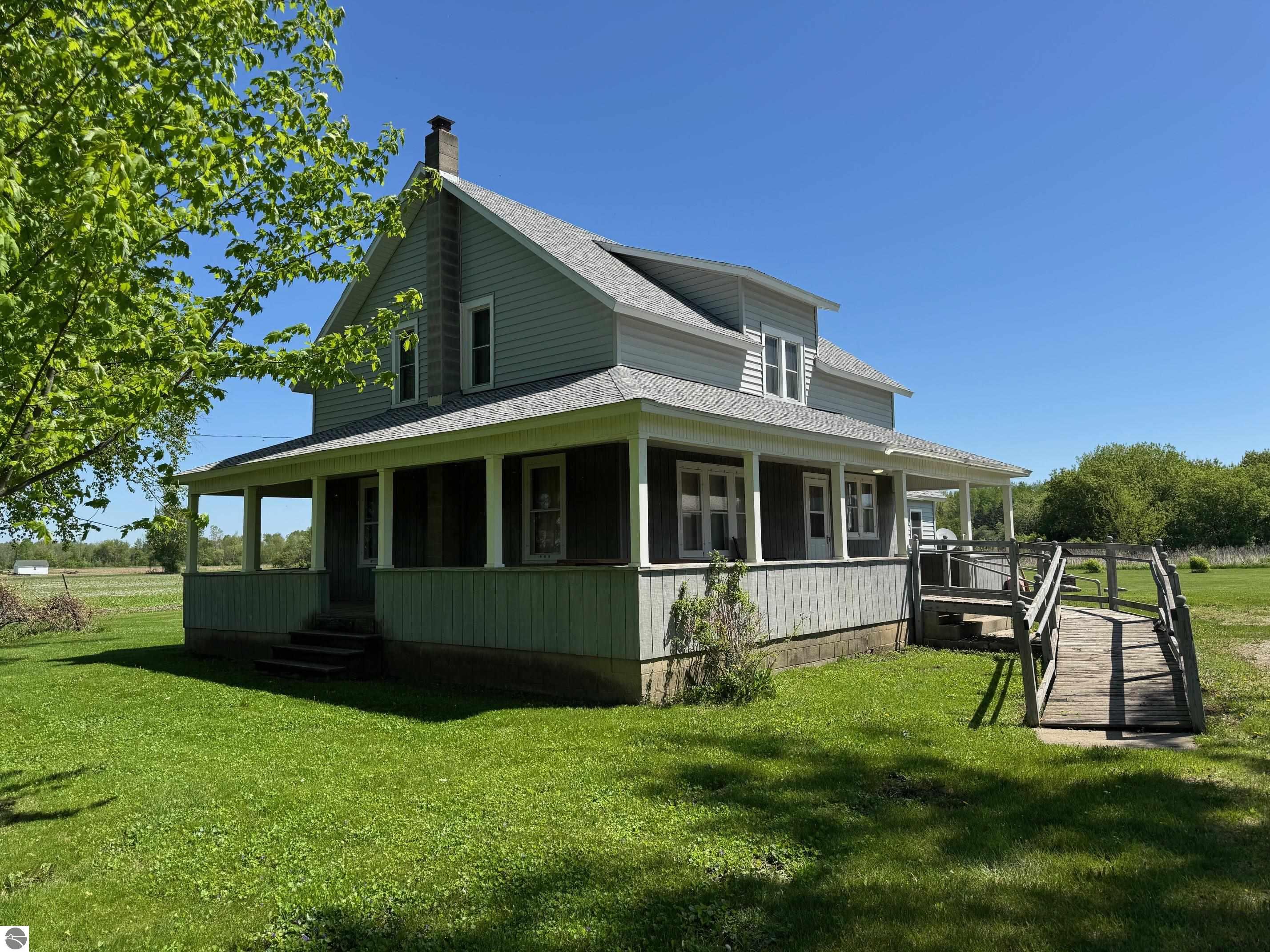 8410 N Wise Road, Clare, MI 48617 — front exterior