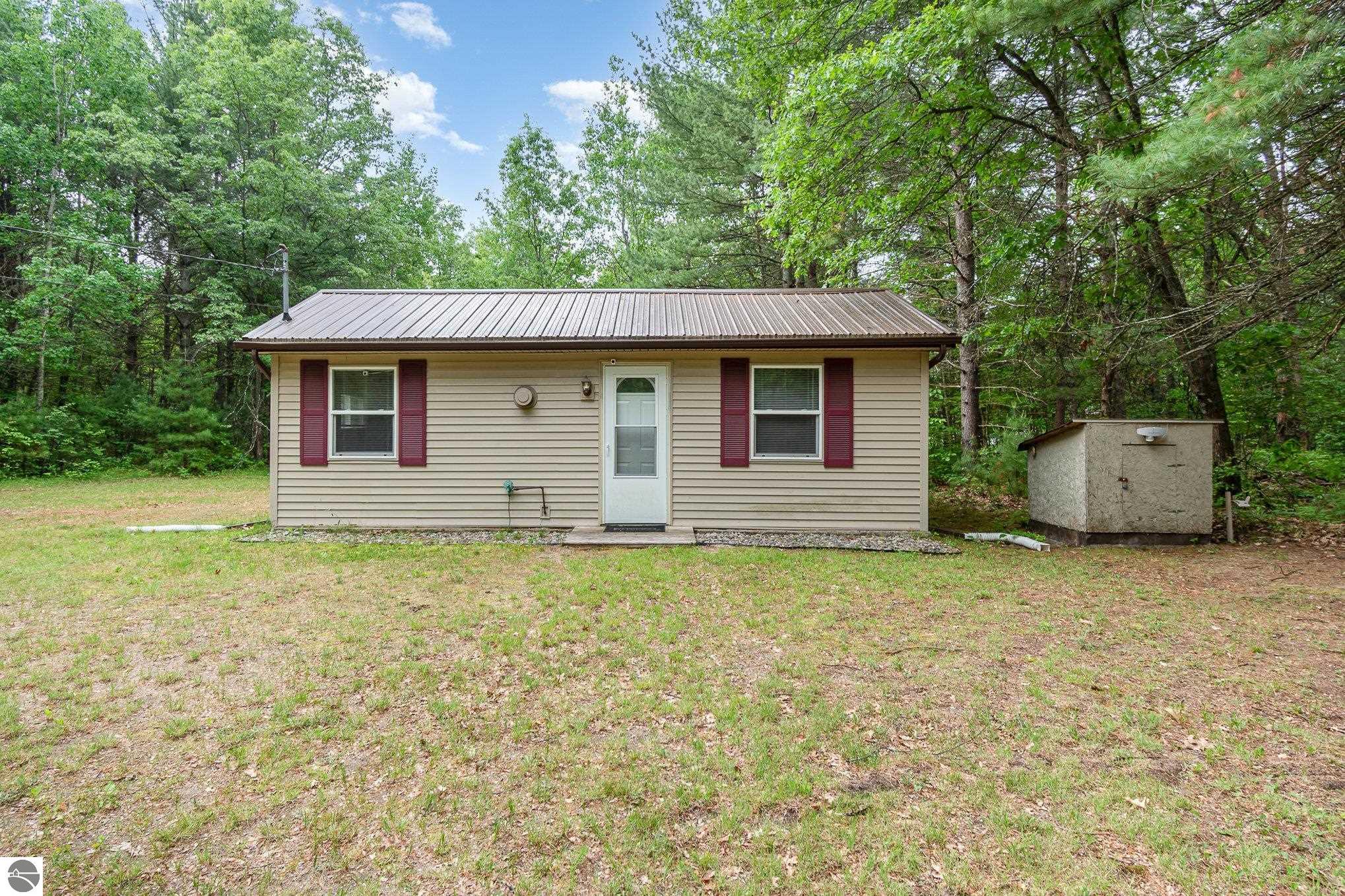 7373 Blue Ox Trail, South Branch, MI 48761 — front exterior