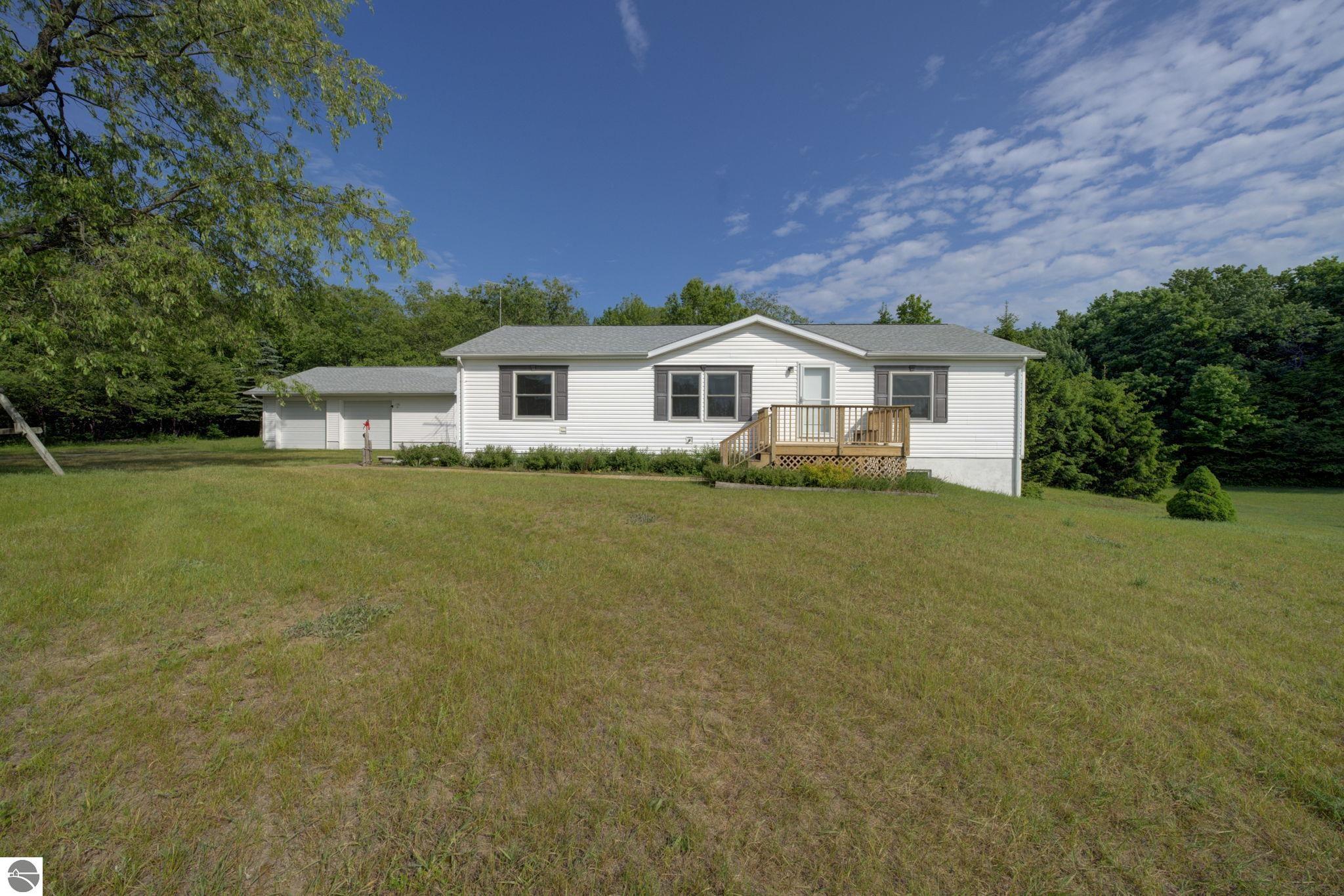 7060 Strawberry Lane, Elmira, MI 49730 — front exterior