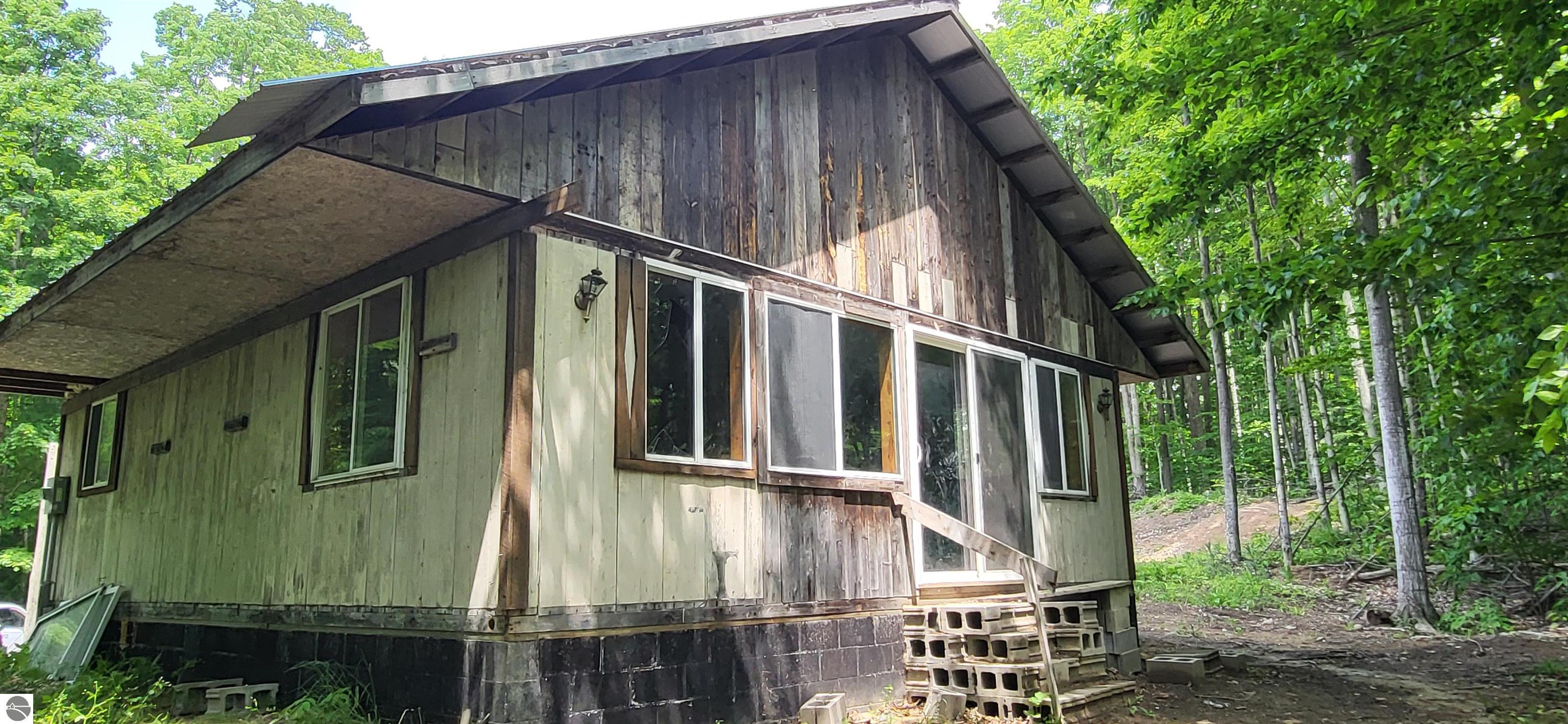 3080 Lewis Road, East Jordan, MI 49727 — front exterior