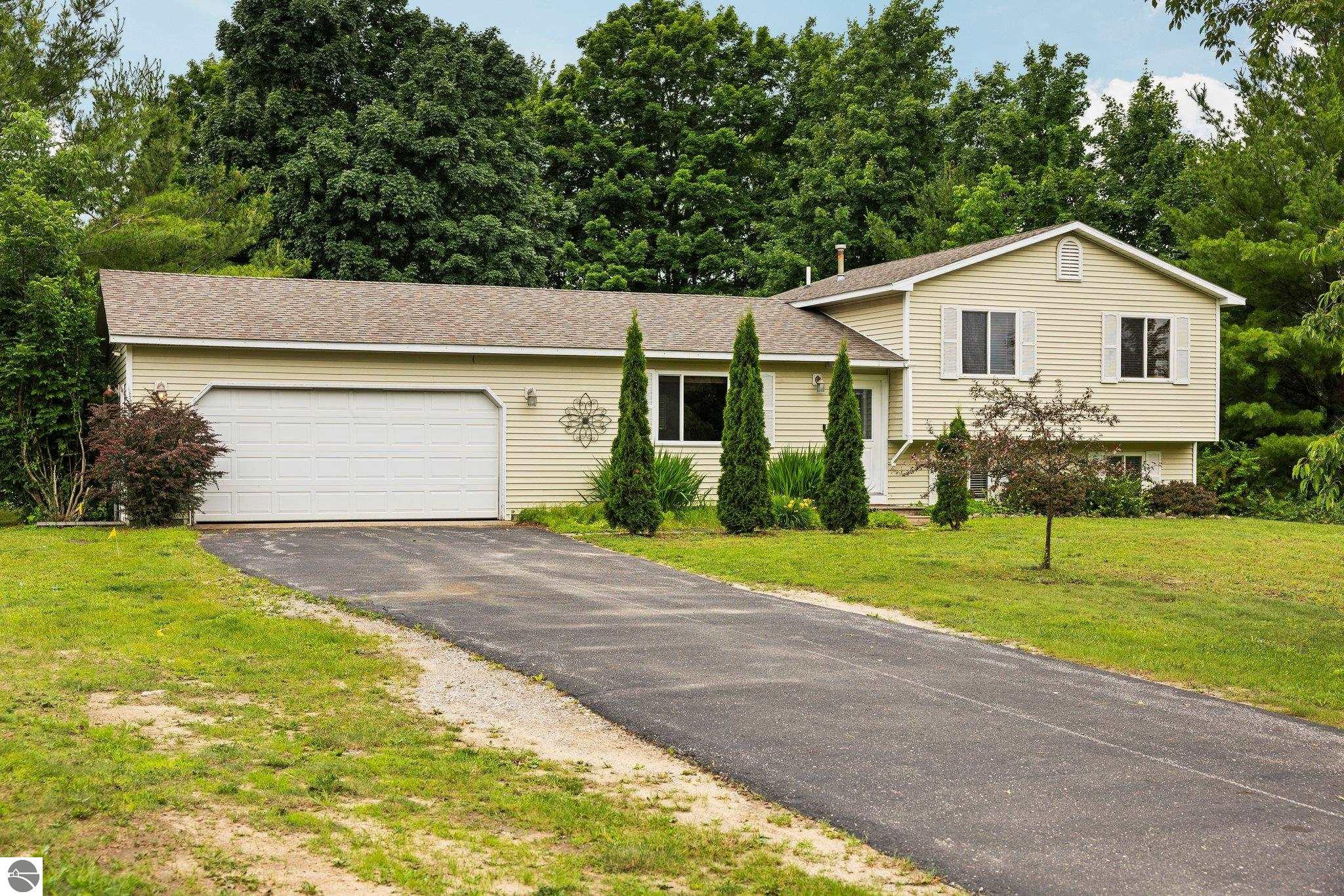 2785 E Sugar Maple Drive, Cedar, MI 49621 — front exterior