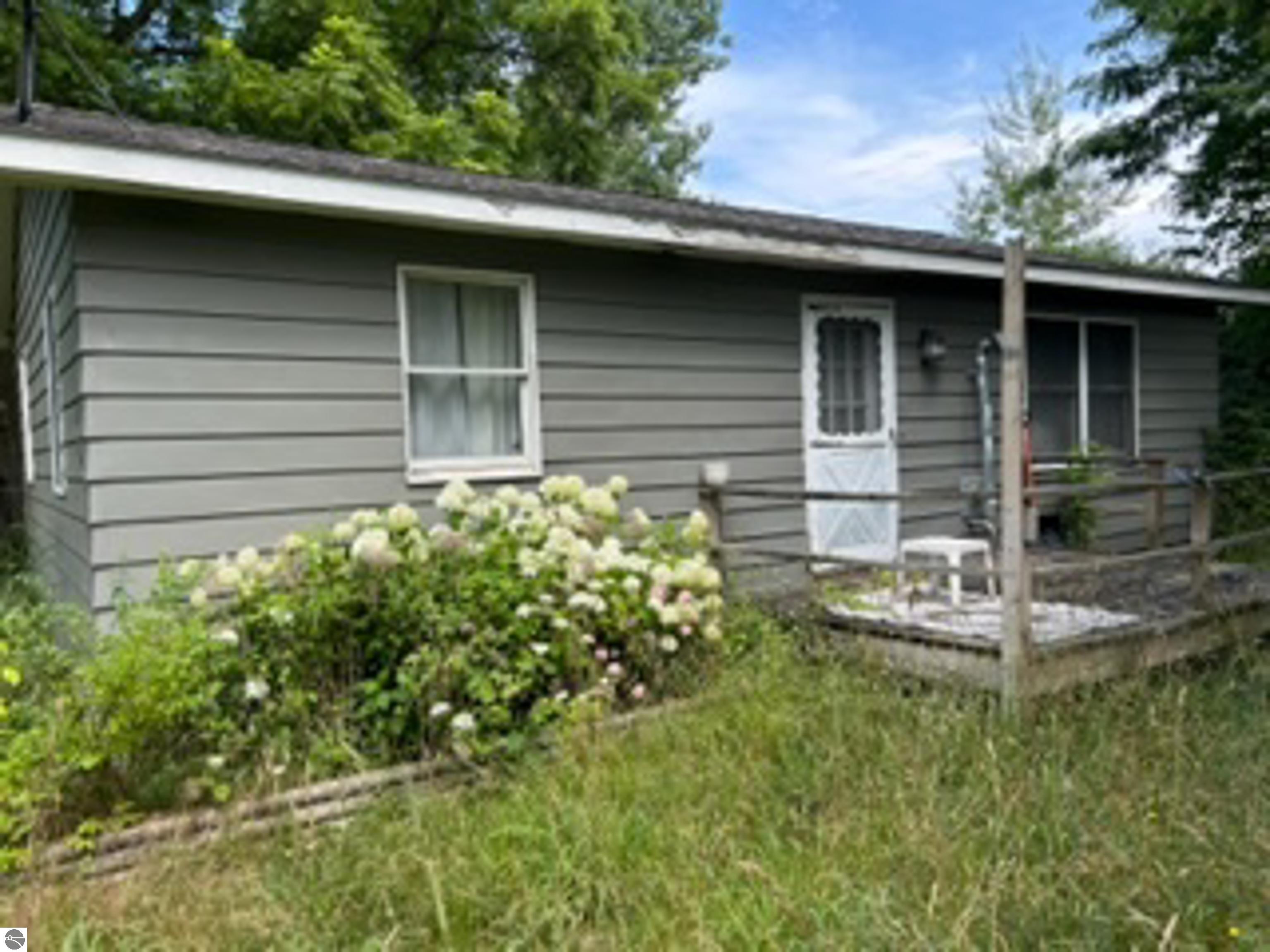 10616 Riverside Drive, Honor, MI 49640 — front exterior