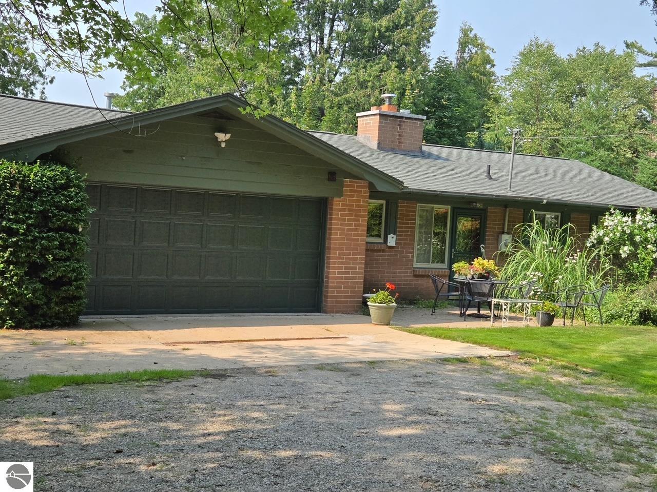 10220 E Elk Lake Drive, Rapid City, MI 49676 — front exterior