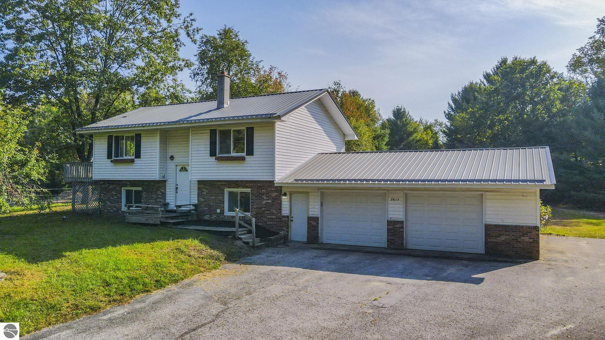 7613 Lake Ann Road, Lake Ann, MI 49650 — front exterior
