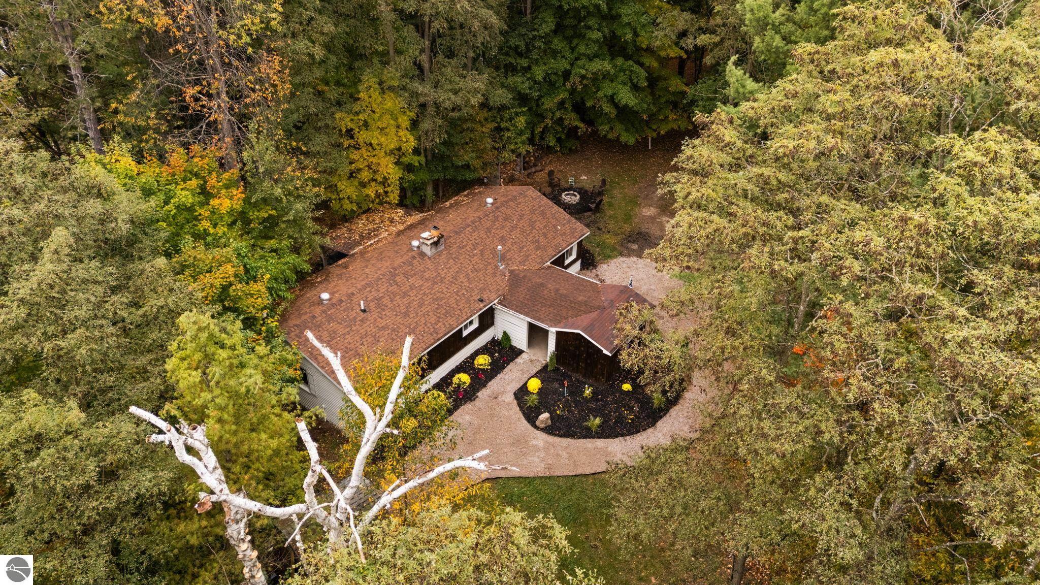 7550 N Reynolds Road, Lake Ann, MI 49650 — front exterior