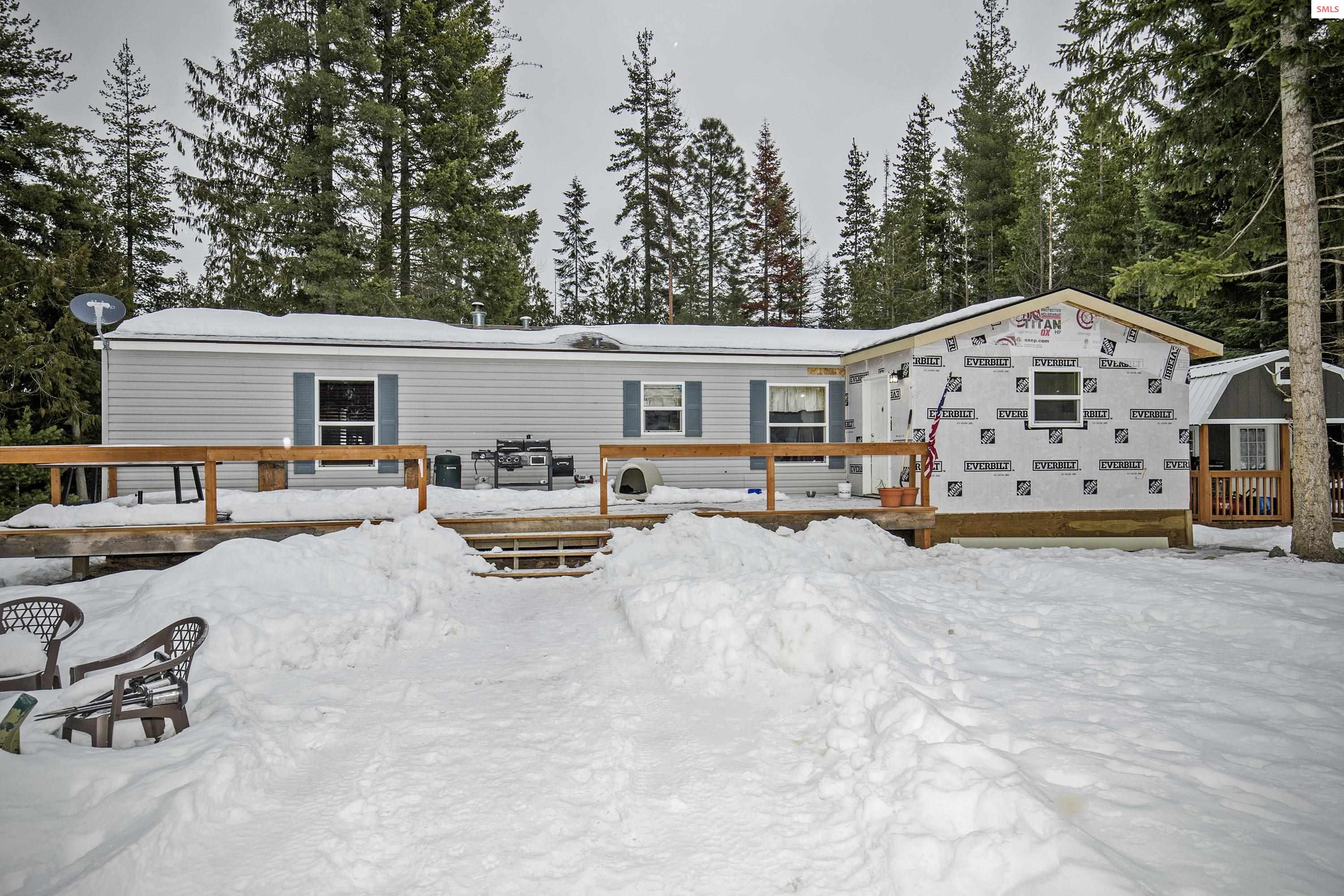 Six prime acres in Sagle!  Two bedroom two Bath home with a great producing well looking for its new owner.  Only a short Drive to Sandpoint and close to Highway 95 for your trip to CDA, ID.  Finish the exterior of the mudroom, install your flavor of trim for the windows and make this your home.