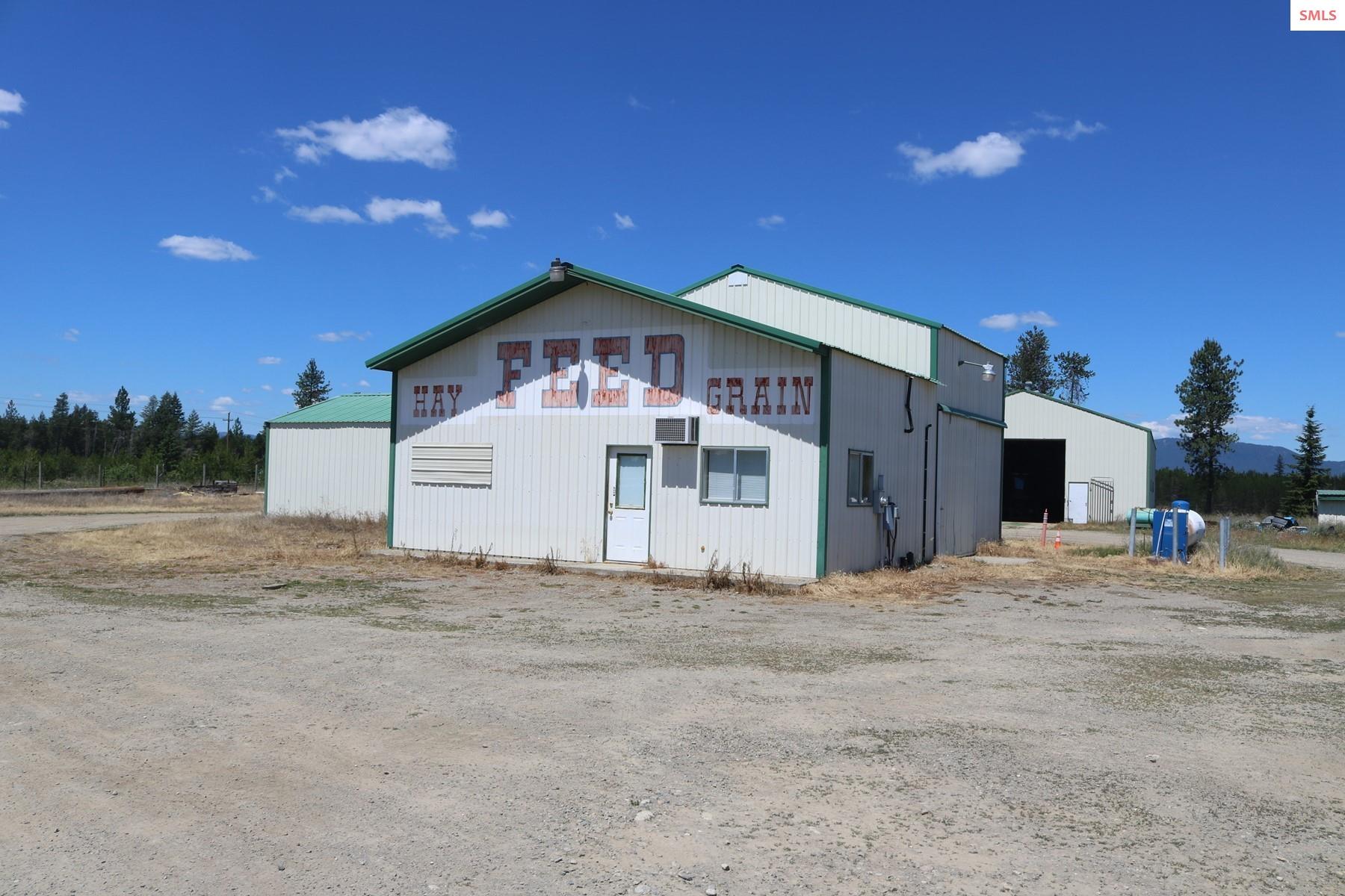 Public remarks: Attention Investors, Developers, Entrepreneurs, large parcel with high visibility Hwy 95 Frontage in the booming town of Athol. With the layout this property is perfect for many commercial activities like storage units, store, manufacturing, home based businesses, etc. Less than ½ mile to the new SUPER 1 Complex and 20 minutes to Hayden/CDA. 9 level acres w/ 3 Phase power, Outbuildings (48x90, & 40x40 w/ a front office of 24x36), 15 gpm shared well, and so much more - SEE FEATURE SHEET! 48x90 insulated shop with concrete floor. Has a ''feed store'' conditional use permit. Driveways built to hold Semi-Truck traffic. The comfortable home on the property is 1 bed/1 bath. There is a pad for double-wide. Rental income $6,300/mo. NO CCR'S or HOA. LOCATION!! Owner terms and Submit all offers!