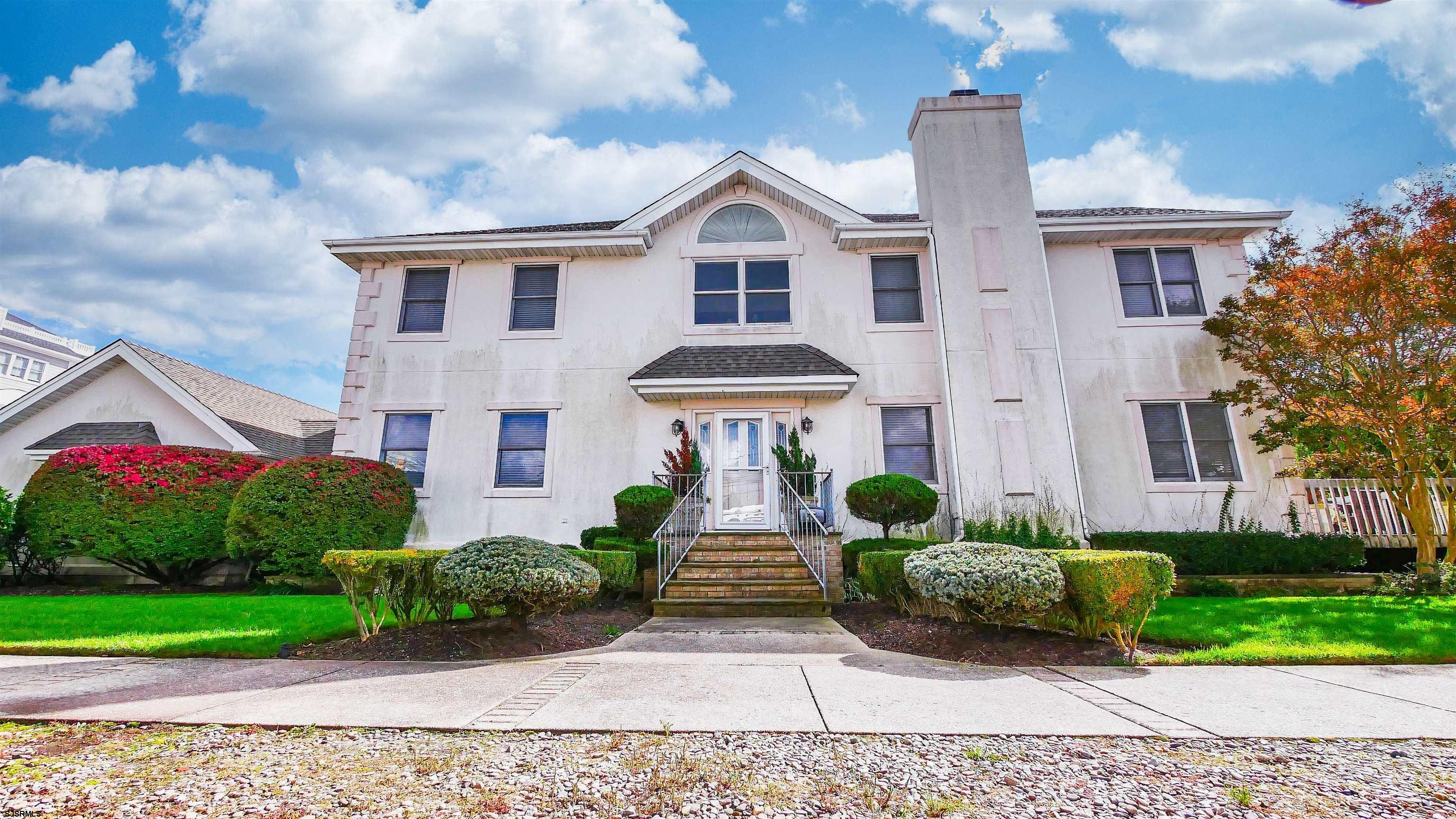 This fabulous two-story beach block home is located in Ventnor's Prestigious St. Leonard Tract.  Ultimate location on a large corner lot, steps to Ventnor Beach and Boardwalk. Tennis & pickleball courts closeby.  The center hall design and open floor plan allows for easy flow between rooms, making it perfect for family gatherings and entertaining.  Two sets of sliding doors open to a large deck surrounded by Arborvitaes for private dining and Barbequing.  Four generous bedrooms and three baths include a massive primary suite with bath, walk in closet, dressing room and a private deck with fabulous ocean views. Additional features include a full size laundry room, outdoor enclosed shower and large two car garage.