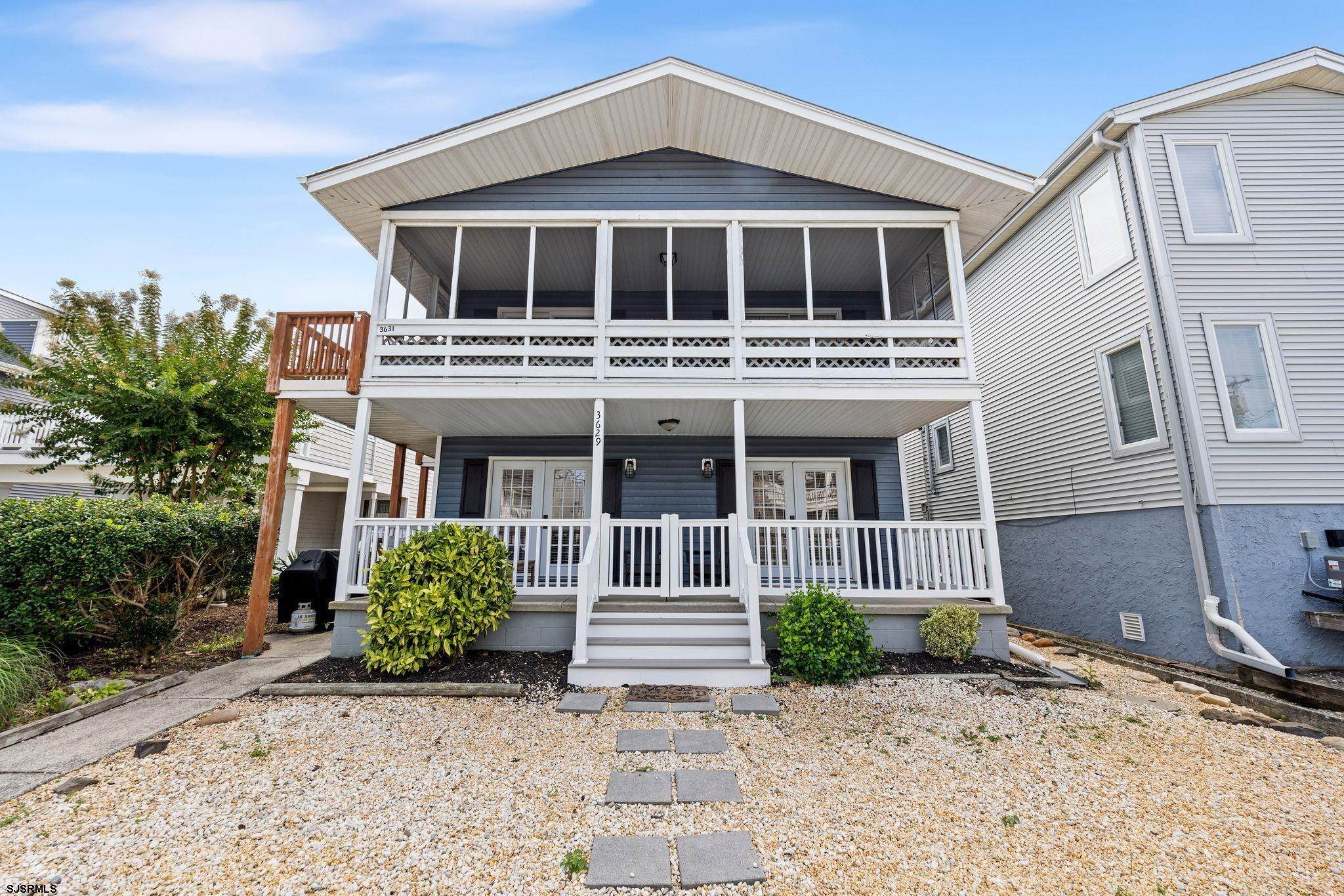 BEACH BLOCK Condo in a PRIME LOCATION!! Just steps to the beach, this modern, coastal-designed condo is the perfect beach house for families and investors alike! The 3-bedroom, 2-bath home features new (2020) HVAC, electric, windows, siding, hot water heater, quartz countertops, shiplap, and modern fixtures. Relax on the big front porch where you are so close to the beach that you can hear the waves crashing! This unit is conveniently located near the beloved 34th St. Park and quite a few popular dining establishments. Outstanding rental history with over $55,000 in rentals booked just between June and August! Offered fully furnished, minus personal exceptions. Other upgrades/improvements include a new washer and dryer, gated porch, roof (2022), new furniture, bathrooms/showers (2022),hot water tanks (2023), curbs and sidewalk (2023) and is freshly painted!
