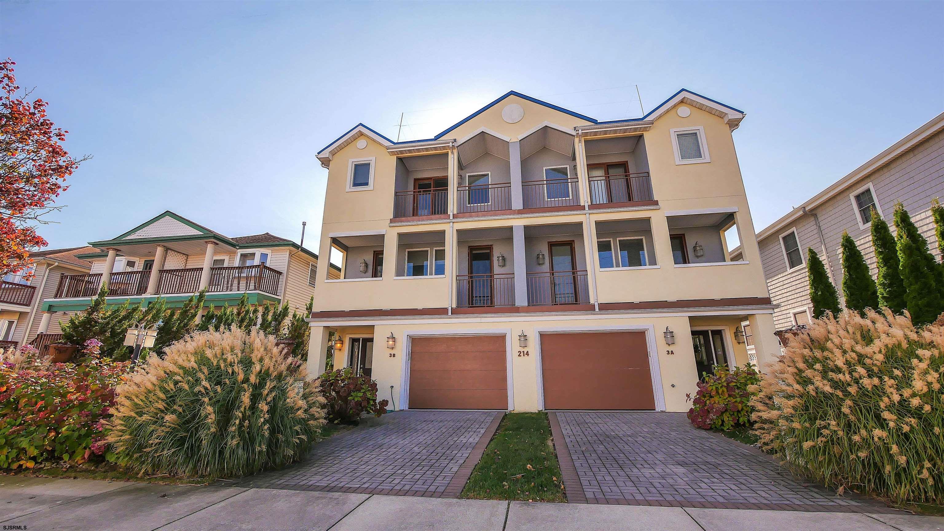 Wonderfully appointed 4-bedroom home, boasting 3 full baths, gleaming wood floors, high ceilings. Enter into the oversized, 2-SUV-size garage, plus 1 space in the driveway. Grand foyer with natural light streaming through all of the elongated custom windows. Make your way up to the main level by the grand staircase or elevator, to a chef's kitchen with commercial appliances, stone counters and island, and pecan cabinets. Perfect for entertaining, with the open great room and dining area adjoined. Large front balcony for perfect moonlight dining or a sunrise breakfast. The primary suite includes a primary bathroom, 2 walk-in closets, and a balcony. Well-kept and never rented. 2 additional bedrooms on the main level with a bath. Large laundry room on the upper floor for ease and privacy. Large closets in every room, storage in the lower level and garage, elevator from garage to upper floor (3 levels). Turn-key sale. Make it your own today!