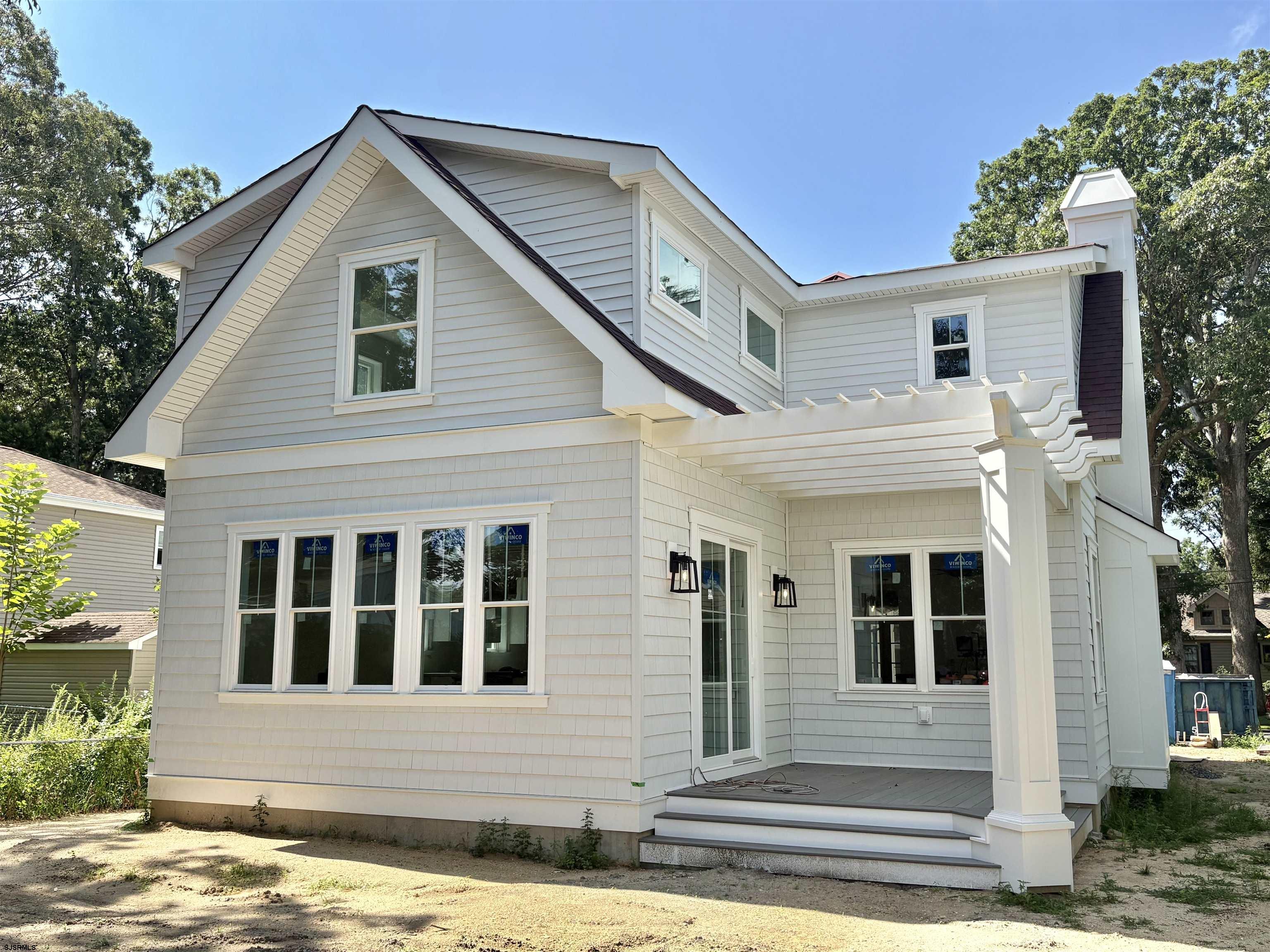 Brand new Super Custom construction right smack in the Heart of Linwood and middle of all the Bikepath action! This unseen design and floorplan are over the top special relative to any past offerings in the history of Linwood's new construction market…(except this builder's other two (2) at the intersection of Maple & Bikepath). 3 of the 4 bedrooms each contain private ensuite bathrooms, the wide-open flow captures light-air and lends a close-knit family lifestyle, while still offering a full basement to create additional recreational space, office, gym, and/or pubroom. The Rich-Classic style, including both the interior and exterior finishes capture, and surpass even the most discerning requirements, prerequisites and refinements of today's educated buyers. A possible first floor bedroom with 4th full bath being centrally located on First Floor. Two (2) covered porches (Front for Sunny Iced tea sippin'), the large rear porch is 14 x 10...so plays like a seasonal outdoor room! Single-car attached garage flows into oversized mudroom w/bench and shelves. This is a uniquely rare opportunity to own ultra-custom real estate is an A+ neighborhood and premium desirable community!