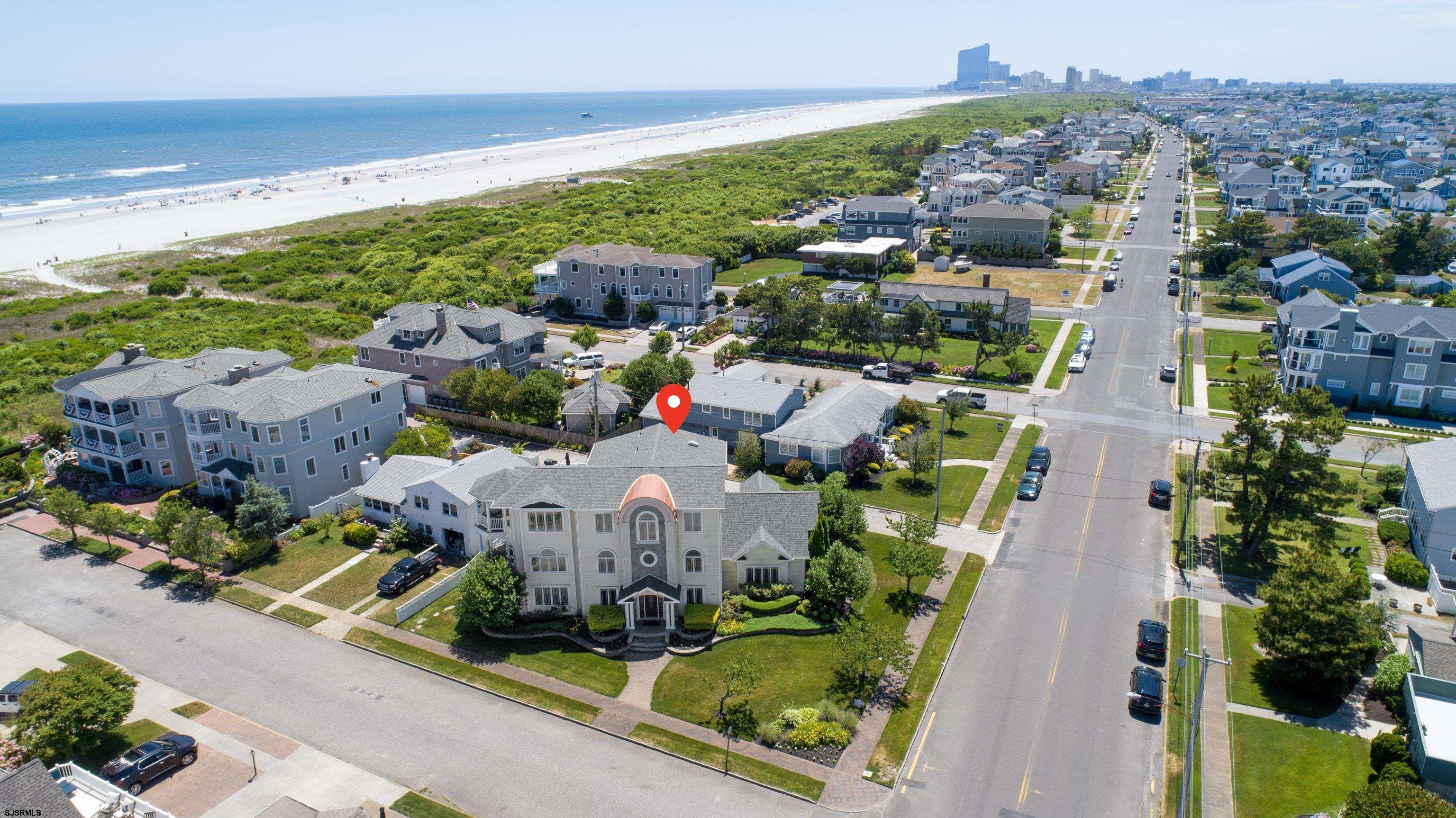 Heart of A-Zone, 400 Block (corner of 23rd & Ocean), Custom Home w/ over 5,800 sq. ft. This is Luxury Living at its finest. 1st Floor:  Pool table/game room or a large home office, 2nd Living Room/Den/Kid's area, 2 large bedrooms w/ ensuite bathrooms. 2nd Floor:  Master Suite w/ Views of the Ocean from your bed. This expansive master suite has one of the largest walk-in closets on the Island; fit for a Queen!  This level also has 2 more bedrooms w/ ensuite bathrooms. 3rd Floor: Main living/gathering area w/ an open floor plan. Expansive Views of the Ocean both inside and out w/ 2 separate viewing, entertaining decks.  Comfortable living room, large dining area, and your gourmet kitchen. Many custom upgrades w/ attention to detail throughout. Elevator, large garage, and ample storage.