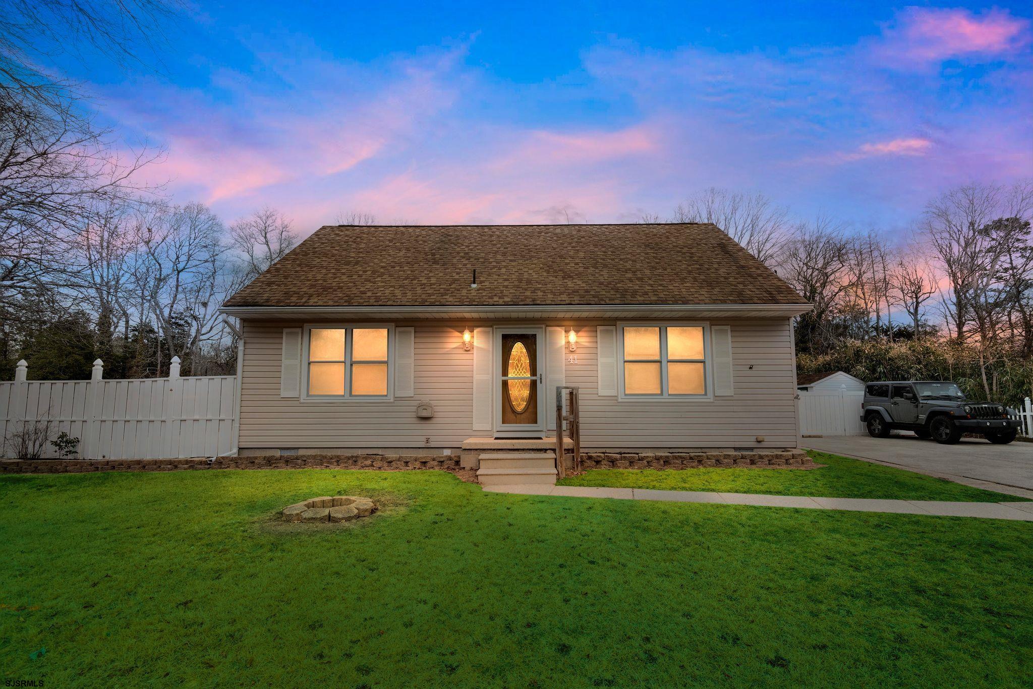 Whether you're riding your bike over to the Dennis Township Recreation Center or taking a short drive over to Sea Isle City beaches or hosting on your large deck in your fenced in backyard, this charming 4 bedroom cape cod style home awaits you. The first floor features two bedrooms and one full bathroom in addition to the living room, kitchen/dining space with laminate/vinyl plank flooring throughout. A laundry closet is also conveniently located on the first floor for easy access. Once upstairs you will find a small hall leading to two bedrooms with endless possibilities. Out the rear sliding door you will find a large, comfortable deck perfect for enjoying a cozy night at home or hosting a large get-together. The backyard is enclosed with a privacy fence and offers two storage sheds for plenty of extra space.
