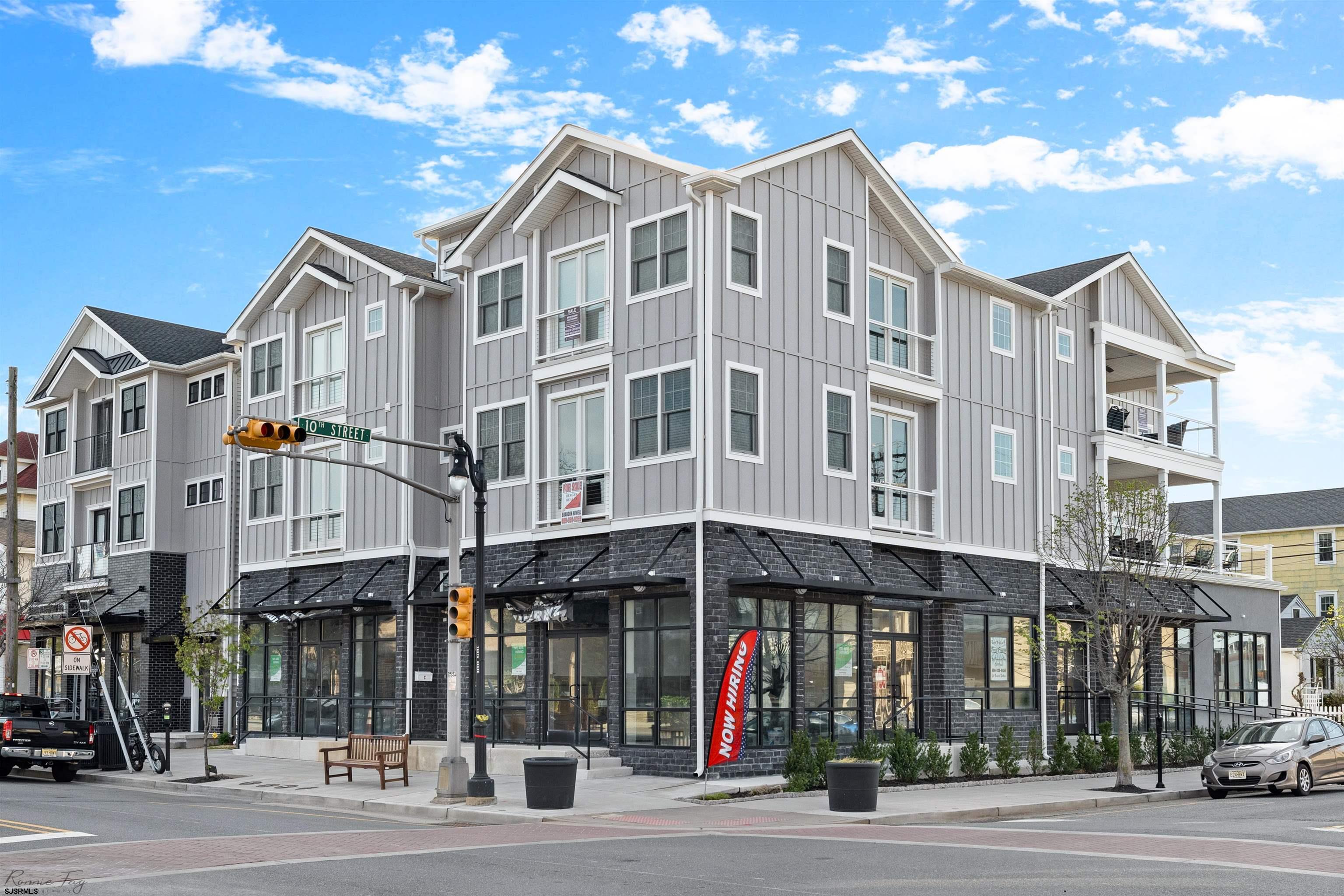 Over $70,000 of rental income already on the books for 2025! Fully furnished and move-in ready, 1000 Asbury delivers an unmatched beachside lifestyle. Perfect for large families or savvy investors, this home stands ready for your next chapter of memories.  Built in 2022, this massive 5 bedroom, 3.5 bathroom condo boasts nearly 2,900 sqft of luxury living space in a walk-everywhere location. The open concept design showcases soaring ceilings and rich hardwood floors flowing throughout. The showstopper kitchen features custom cabinetry, quartz countertops, and a oversized island with seating for 6 – ideal for entertaining friends and family.  The master bedroom includes a private en-suite, while two additional full Jack-and-Jill bathrooms and a convenient half bath off the living room complete the layout. Outside, the spacious deck overlooks Asbury Ave, perfect for evening relaxation. Off-street parking, separate garages, and an outdoor shower add the finishing touches to this exceptional Ocean City property.