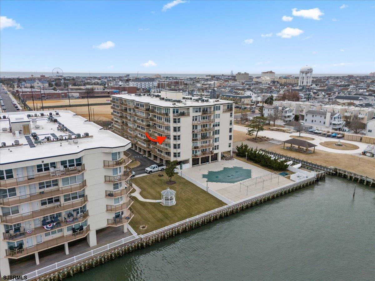 This beautifully maintained 2-bedroom, 2-bathroom condo offers breathtaking water views and a perfect blend of charm and comfort. Located directly on the bay, this property invites you to relax and enjoy waterfront living at its finest. Step inside to find an open concept living space bathed in natural light, with large windows. The dining room flows seamlessly into a spacious kitchen equipped for entertaining guests or enjoying a quiet morning coffee. The primary bedroom features an ensuite bath and generous closet space, providing a peaceful retreat with water views. A second bedroom offers flexibility for guests or a home office, while the additional full bath ensures convenience and privacy. Outside, the private deck allows you to soak in bayfront sunsets. Whether you’re looking for a year-round residence or a weekend getaway, this bayfront gem delivers the best of coastal living. Don’t miss the chance to make it your own!