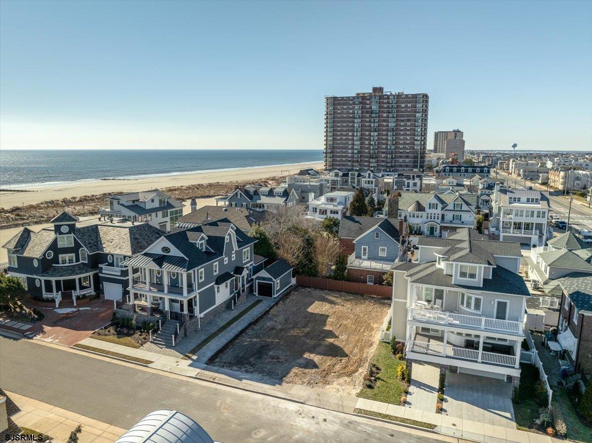 Luxury will be redefined in this spectacular BEACH BLOCK NEW CONSTRUCTION coming to one of Margate's most desirable Parkway streets. One of the nicest and most impressive homes currently being built on the island! Built by Revolution Builders, this show stopper will feature a large pool with hot tub/spa, covered veranda in the backyard, ELEVATOR, huge 3rd floor panoramic deck and all of the nicest, custom upgrades you could ever imagine. Modern touches and finishes with clean lines. JUST THE 3RD HOUSE FROM THE BEACH WITH DIRECT, STUNNING OCEAN VIEWS FROM EVERYWHERE YOU LOOK!! 5 Bedrooms, 5.5 designer baths on 4 levels. Built to new building standards with 2.5 stories above an attached garage for the most spectacular views. The features go on and on and are too numerous to list! Massive yard with outdoor kitchen and amazing entertaining space at the beach. This house can be completely customized down to every detail. Connect now to meet the builder, pick your finishes and design your dream home. This house will be feature ONLY THE BEST! Walking distance to everything in one of the prime Parkway locations and on of the nicest beach blocks. These homes are hard to come by and will be so special for your family memories at the shore!