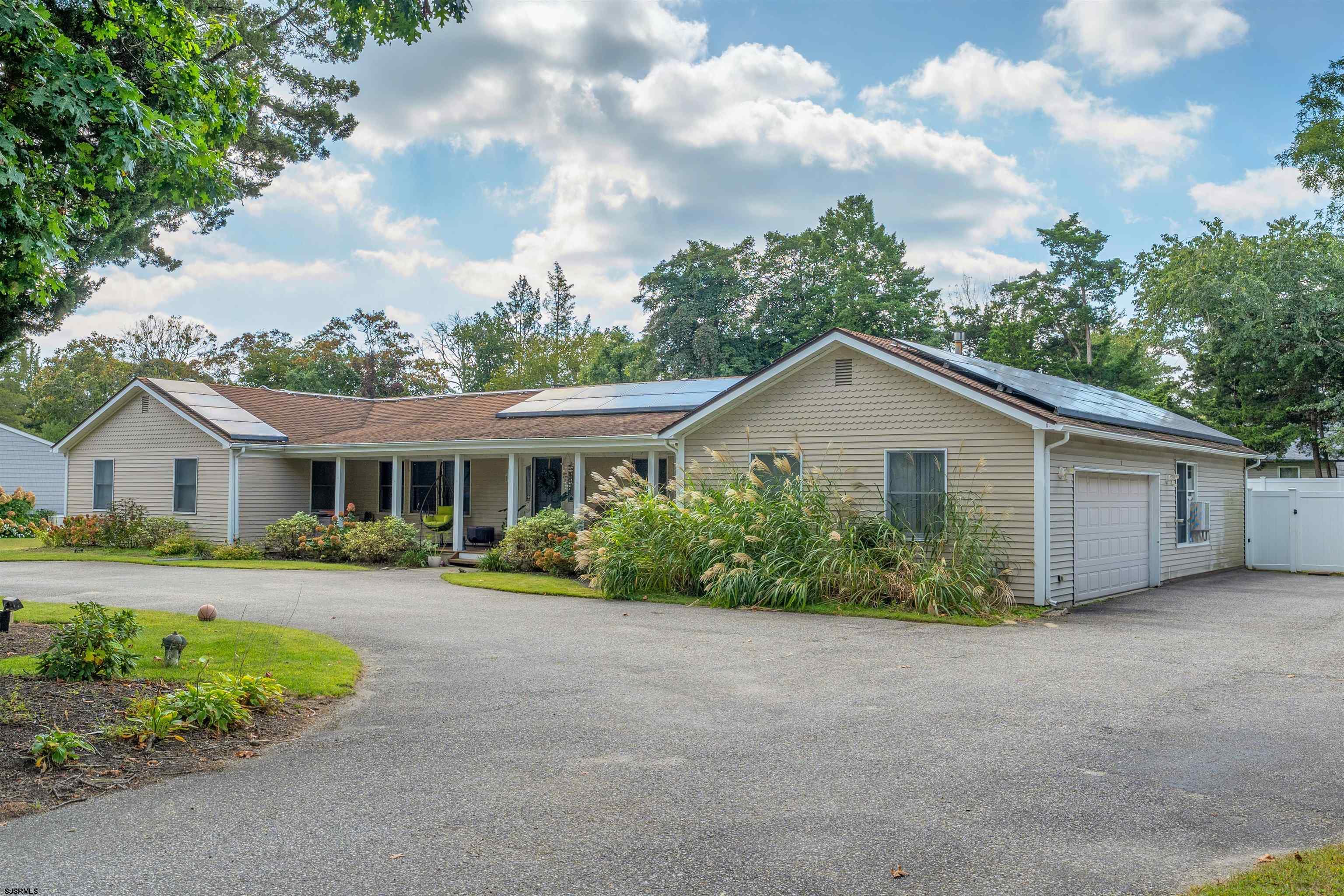 MOTIVATED SELLER.  Seller has secured employment out of state and must SELL! Make your appointment to see This corner property which offers loads of space for all your family needs and then some! Pull up into the very large side driveway which takes you into the 2 car attached garage, you and your guests will appreciate the semi-circular driveway which offers plenty of personal and guest parking...Which you will appreciate when you step inside and see all this home offers. The cozy covered front porch offers plenty of room to relax, step into the LARGE entry way with wood floors throughout, this entrance takes you into the spacious bright home which just screams comfort. To the right you will find a very large dining room with large windows to bring in the sunlight, to the left you will find a very spacious living room again with large windows, gas fireplace and plenty of room to entertain friends and family while maintaining that cozy feeling. Continuing through the LR you will find a beautiful bright Florida room with large windows, French doors to the back deck and a sky light to ensure maximum sun exposure while sitting inside. The kitchen boasts granite countertops, loads of cabinetry, a coffee bar/microwave station, stainless appliances all replaced over the past five years. Down the hall you will step into your large laundry room with additional cabinetry for more storage and also offers the multifunction of a half bath. This side of the home is where you will find a newly renovated In-Law Suite with a beautiful sitting room showing off beautiful mahogany ceilings and built in shelves, of course a private bath and spacious bedroom and just as is indicative of the rest of the home this suite has beautiful large windows so you get loads of sunlight, step out of the private access to the fenced back yard or you also have direct access through the garage. Head all the way to the other side of the home and you will find three very large bedrooms a large hall bathroom and the Primary Suite is a MUST SEE! Offering again BRIGHT sunlight from the large sliding WALL which takes you right out to the beautiful step-up deck where you can enjoy your morning coffee and an evening glass of wine, additionally you will just love the walk-in closet and the stunning private bathroom with double sinks, sunken tub and walk in shower, again A MUST SEE! All the bright indoor space is not where the splendor ends, step out to the lovely and privacy fenced back yard via several outdoor access points and you will find...An above ground pool, a hot tub, several decks some offering some shade and some in bright sun! The decks and pool do not take up all the space so you will also find a small garden shed to keep the tools for what you will agree isa great use of one side of the yard now fenced off with raised garden beds, and with all this you still have plenty of space for kids to play and for family and friends to enjoy out door games. Storage is never a problem in this home as there is an attic accessed from the garage and plenty of storage shelves to keep your stored items neatly organized in the attached garage. Make your appointment to tour this home asap.
