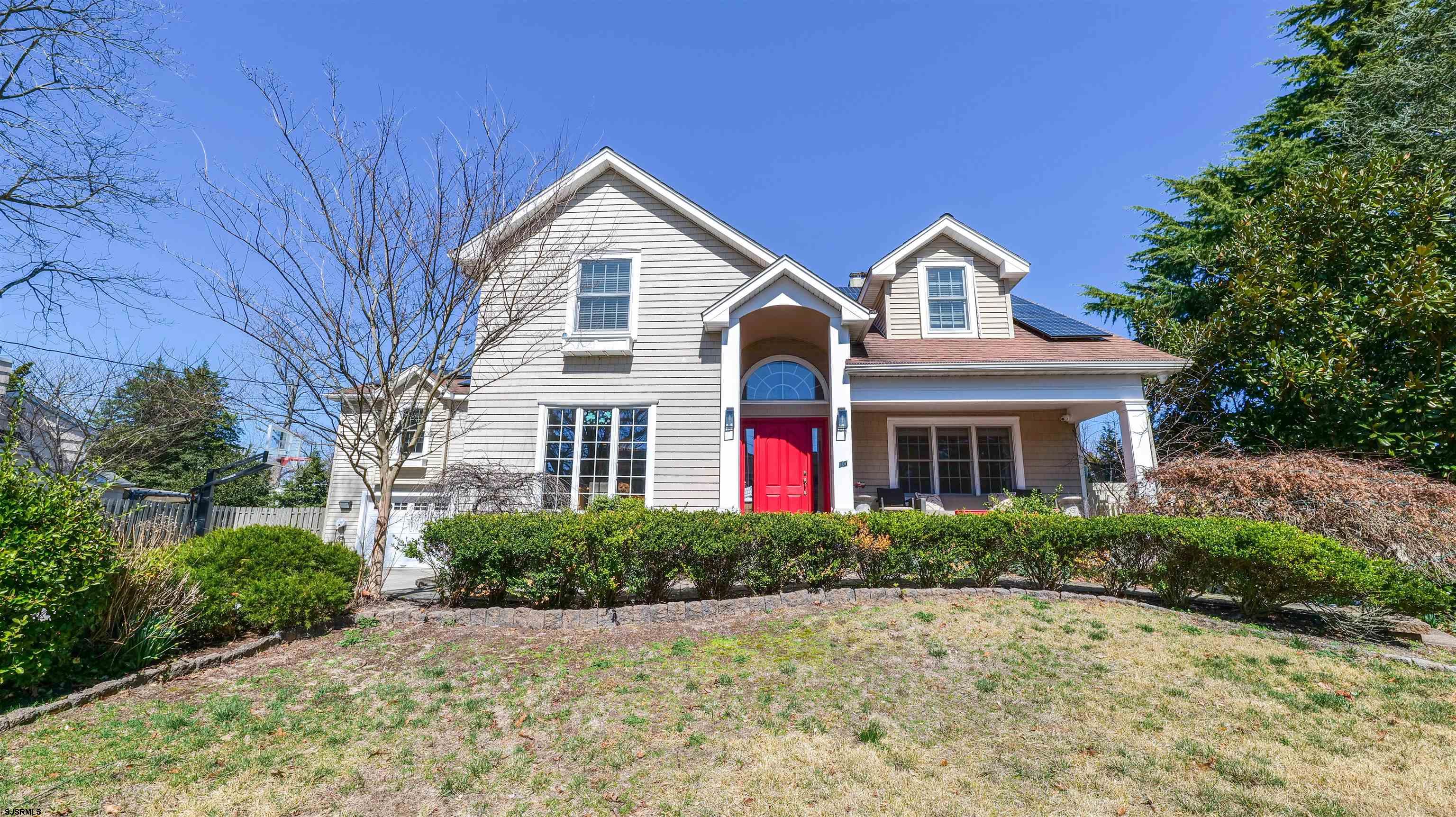 This stunning expanded split-level home is located in the desirable town of Linwood, NJ. Perched upon a hill with stately curb appeal, this property offers close proximity to the top-rated Linwood school system, 2 blocks to the bike path and is just a short drive from the popular Ocean City and Margate beaches and boardwalks, making it an ideal location for families and beach lovers alike.  The home's impressive exterior features a 4+ car driveway, pavers, and lush, professionally installed landscaping. A pavered and covered front porch leads to a custom solid wood red entry door, opening into an impressive vestibule that sets the tone for the elegance throughout the home.  Inside, the spacious family room boasts decorative custom woodwork, crown moldings, recessed lighting, and gleaming hardwood floors. A gas fireplace with a marble surround and stunning white mantle adds warmth and charm. The living room is enhanced by custom window treatments, adding both style and privacy.  The inviting eat-in kitchen is a chef’s dream, featuring a large dining area with a multi-level center island with seating for four, granite countertops, solid wood cabinetry, tile floors, and stainless steel appliances — including a gas cooktop, stainless steel hood, and a built-in ice machine. A tumbled marble backsplash and updated lighting complete the space, which is bathed in natural light from the floor-to-ceiling window.  Upstairs, all the bedrooms are generously sized. The primary suite is a true retreat with three large closets finished with a California Closet type systems, a sitting area, and impressive vaulted ceilings. The luxurious en suite bathroom features a $12,000 Toto toilet and a steam shower for ultimate relaxation. The kids’ bathroom offers convenience with two sinks, perfect for busy mornings.  Also on this level is an enormous rec room with hardwood floors, cathedral ceilings, a gas-burning fireplace and a striking stone wall.  The lower level includes a spacious family room with new flooring, a built-in wall unit, and an additional bedroom with its own full bathroom — ideal for guests or extended family. There is also a full Basement for additional space for fun and frolicking! The large laundry room on this level features built-in cabinetry for added storage and an extra freezer.  For entertaining, the sunroom offers tile floors, slider doors that open to the backyard, and plenty of space to unwind. Step outside to discover an amazing backyard oasis featuring a fully fenced yard, a massive in-ground, gunite with a French Dimond floor, salt water swimming pool and hot tub with Pentair energy saving pump, heated and remote controlled by your phone. Starts at a depth of 3 feet and goes to 8 foot deep, travertine pavers, and a covered outdoor built in Bar and kitchen equipped with a granite-top bar, running water, Sedona brand BBQ grill, ice machine, refrigerator, completed with a large screen TV — perfect for summer gatherings!  Completing the home is an oversized 2-car garage with additional refrigerator, updated systems, including newer split HVAC Split units and updated sewer pipes, plumbing and a French drain for peace of mind.  Don't miss your chance to own this exceptional home that combines comfort, luxury, and unbeatable location.