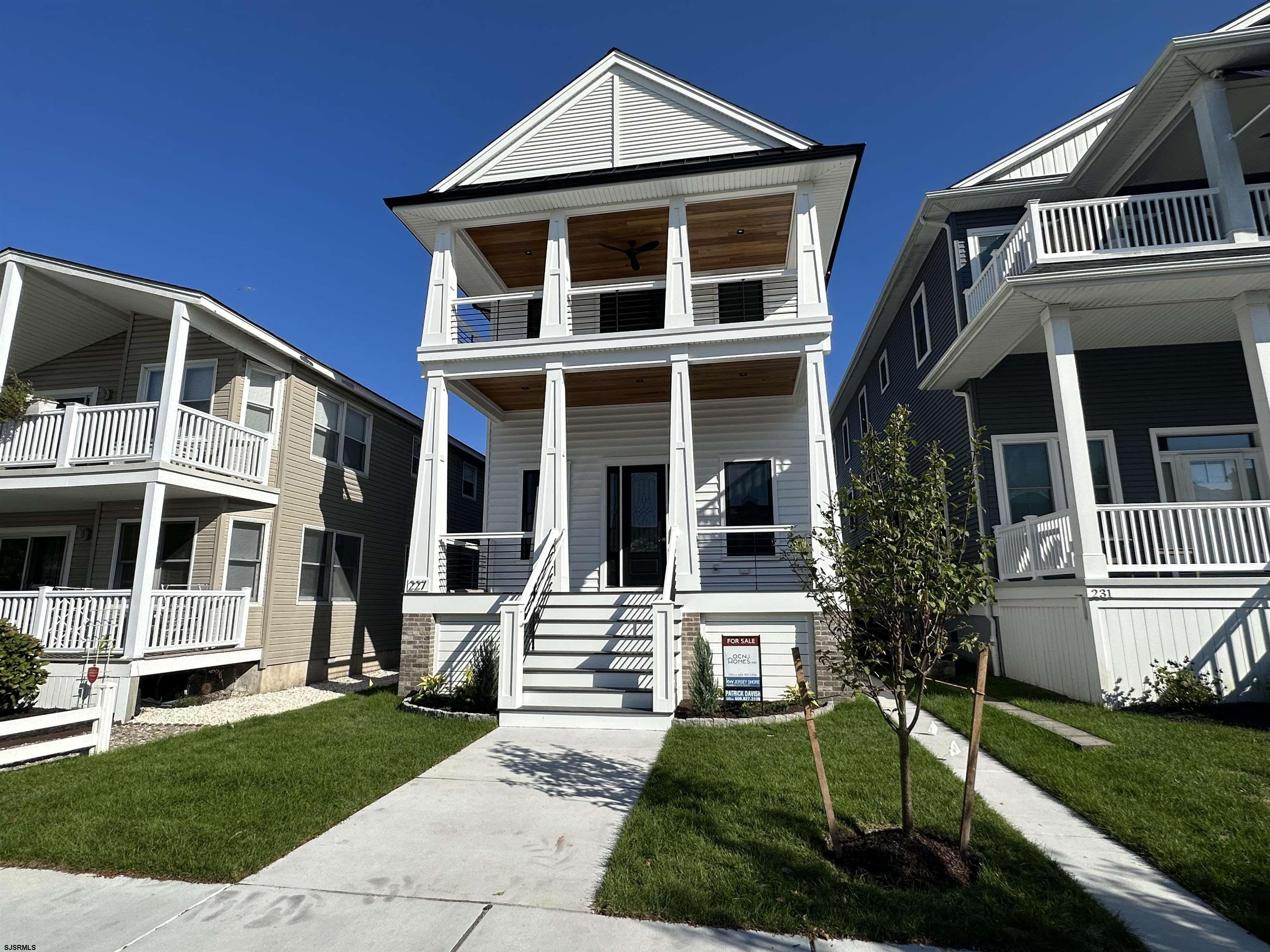 Incredible NEW CONSTRUCTION condo located just a short walk from the beach and boardwalk in the sought-after Northend neighborhood of Ocean City. This meticulously designed 1st floor unit offers 4 bedrooms + a den (or small bedroom) and 3 full bathrooms. The gourmet custom kitchen is a chef's delight with premium cabinetry, stone counters, stainless steel appliances, a custom tile backsplash and a large center island to entertain family and guests. Additional highlights include a gas fireplace, gas heat, central air, ceiling fans, front and rear decks, an attached garage, additional off street parking for 2 cars and more. Built with top-tier, low-maintenance materials, this unit promises exceptional craftsmanship. This property is situated in a desired neighborhood that could offer excellent rental income as well. 2nd floor (229 Ocean Ave) is also available if you desire the whole building. Visit OCNJHomes.com to schedule your private tour and additional details.