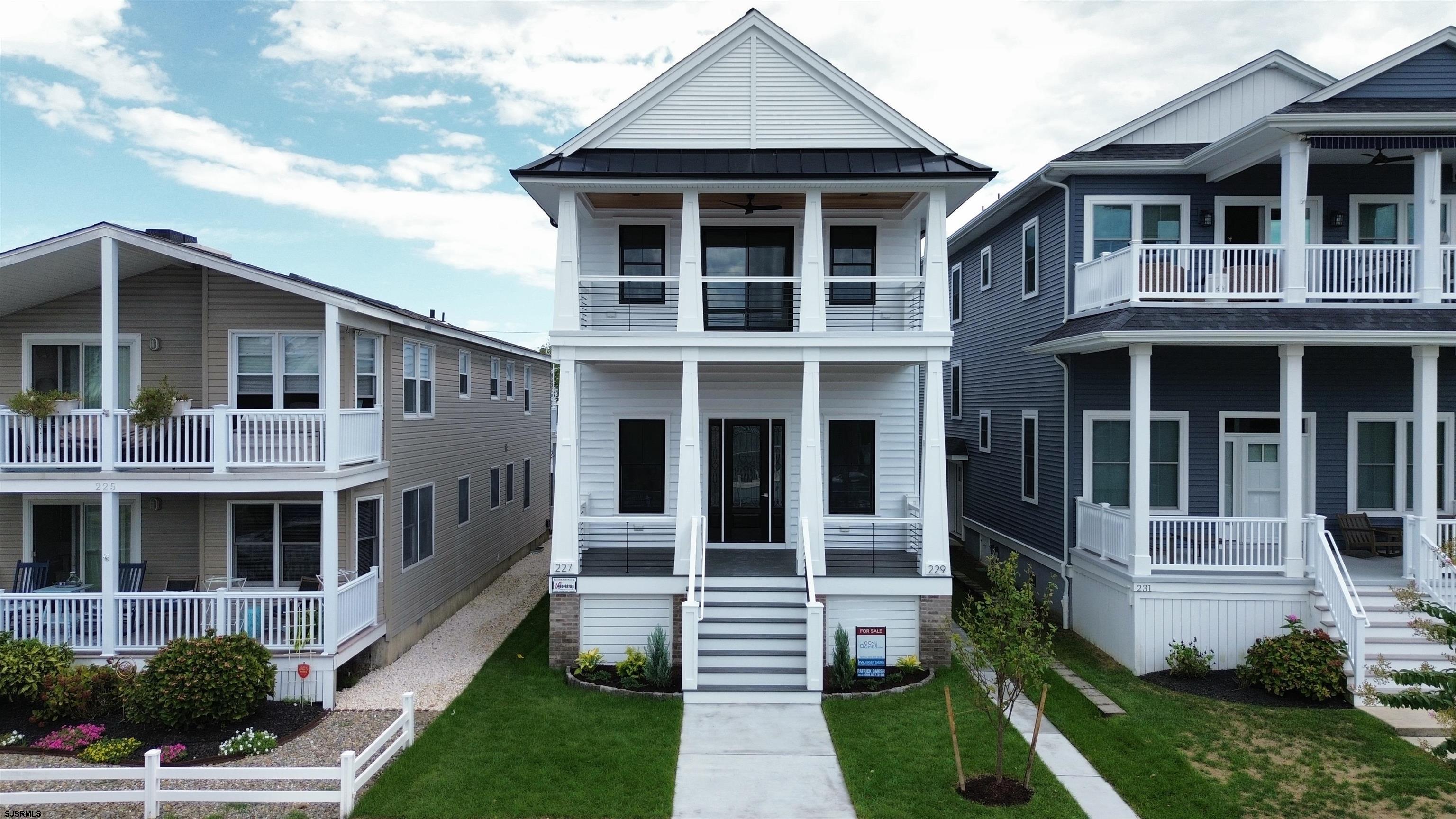 Incredible NEW CONSTRUCTION condo located just a short walk from the beach and boardwalk in the sought-after Northend neighborhood of Ocean City. This meticulously designed 2nd floor unit offers 4 bedrooms + a den (or small bedroom) and 3 full bathrooms. The gourmet custom kitchen is a chef's delight with premium cabinetry, stone counters, stainless steel appliances, a custom tile backsplash and a large center island to entertain family and guests. Additional highlights include an elevator, gas fireplace, gas heat, central air, ceiling fans, front and rear decks, an attached garage, additional off street parking for 2 cars and more. Built with top-tier, low-maintenance materials, this unit promises exceptional craftsmanship. This property is situated in a desired neighborhood that could offer excellent rental income as well. 1st floor (227 Ocean Ave) is also available if you desire the whole building. Visit OCNJHomes.com to schedule your private tour and additional details.