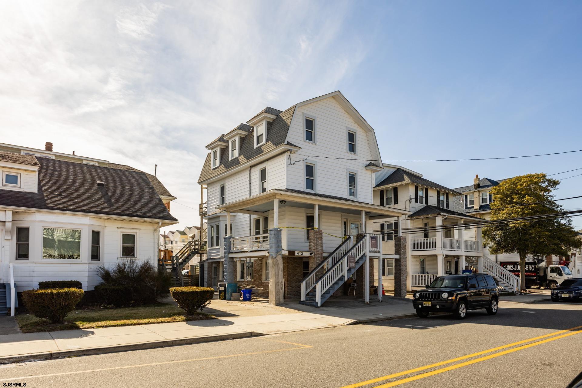Charming, fully remodeled 5-bedroom, 4-bath home in Ocean City, featuring 3 levels of living space with 2 separate living areas, including a wet bar. This home boasts brand-new vinyl siding, a freshly painted interior, and new flooring throughout. The updated kitchen includes all new appliances. Located near the heart of town, it's within walking distance to the downtown area, boardwalk, and beach.