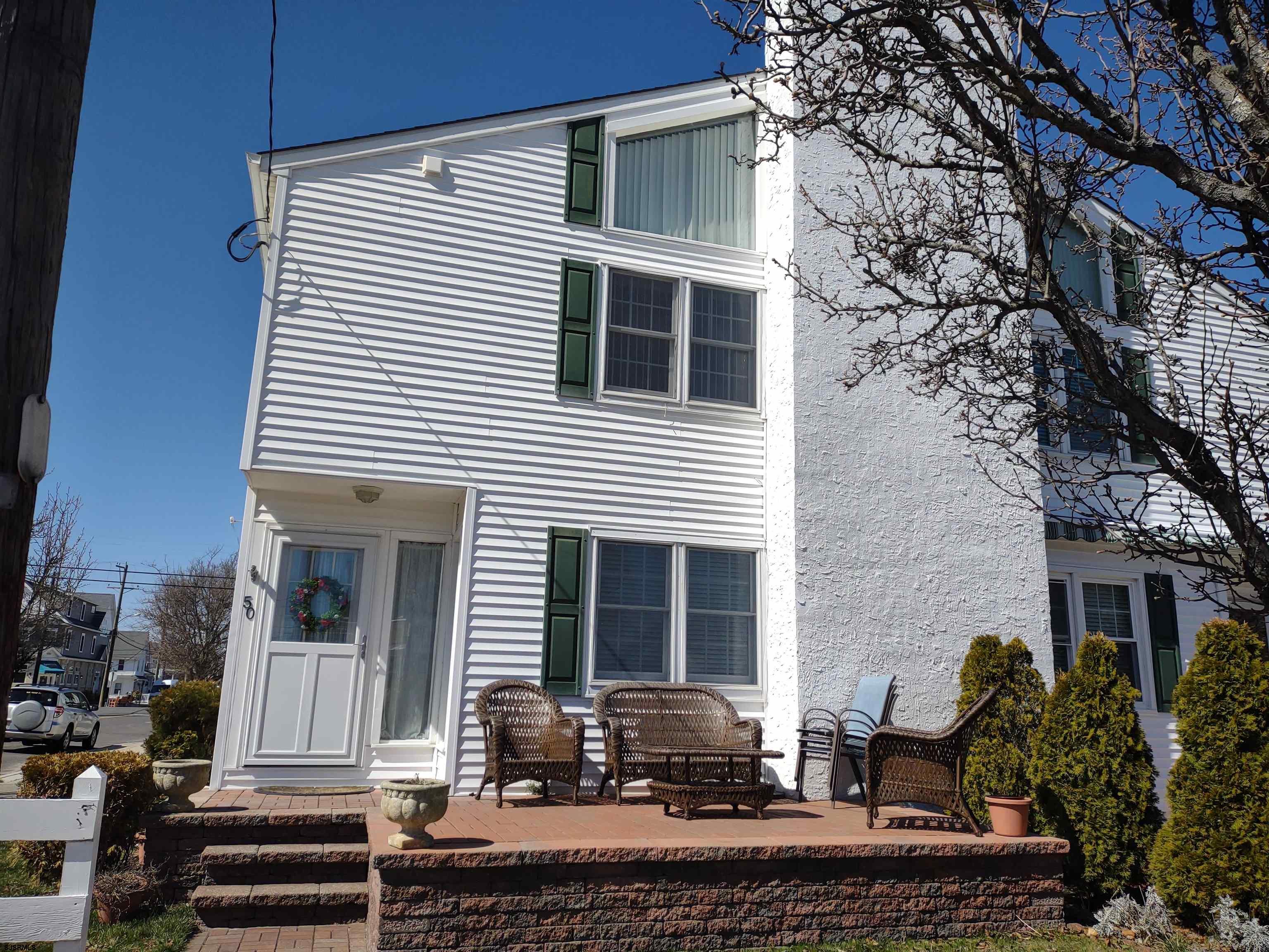 Beautiful 2 story corner townhouse. 3 Bedrooms, 2 1/2 baths, den area, gas heat, central air, tankless h/w, vinyl siding, newer roof, 2 car off street parking, front deck, nicely landscaped, large attic space and outside storage. Very clean, bright and modern. Rare find, don't miss this one!