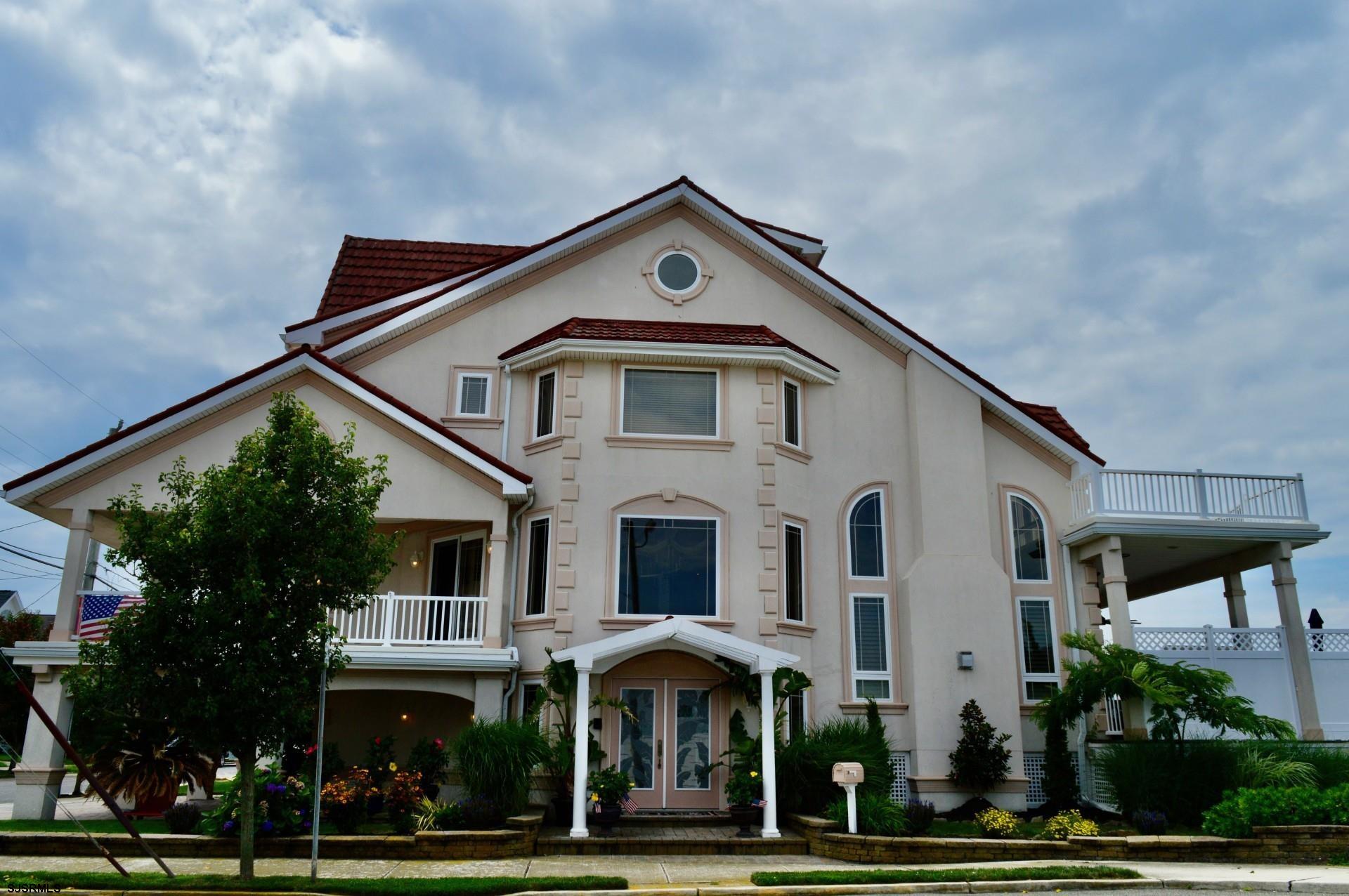 OWNER FINANCING AVAILABLE! Why wait for bank appraisals, approvals, and all the extra costs and fees? Step into waterfront living today — no delays, just endless views and pure coastal serenity.  From the shimmering skyline of Atlantic City to miles of open bay, this home offers unmatched panoramic water views that will take your breath away. Enjoy your morning coffee as the sun rises over the Atlantic, or unwind with evening cocktails on your private rooftop deck as the sun sets to the west.  Inside, you'll find soaring ceilings and a bright, open layout — perfectly designed for both entertaining guests and hosting family gatherings. The spacious interior blends comfort and style, creating the ideal setting for making memories year-round.  Located in one of Ocean City’s rare deep-water, no-wake zones, you'll enjoy 24/7 boating access just minutes from the Longport Inlet. No need to worry about tides — with deep water right at your back door, your boat stays ready for adventure anytime.  This is more than a home — it’s your gateway to the ultimate coastal lifestyle.
