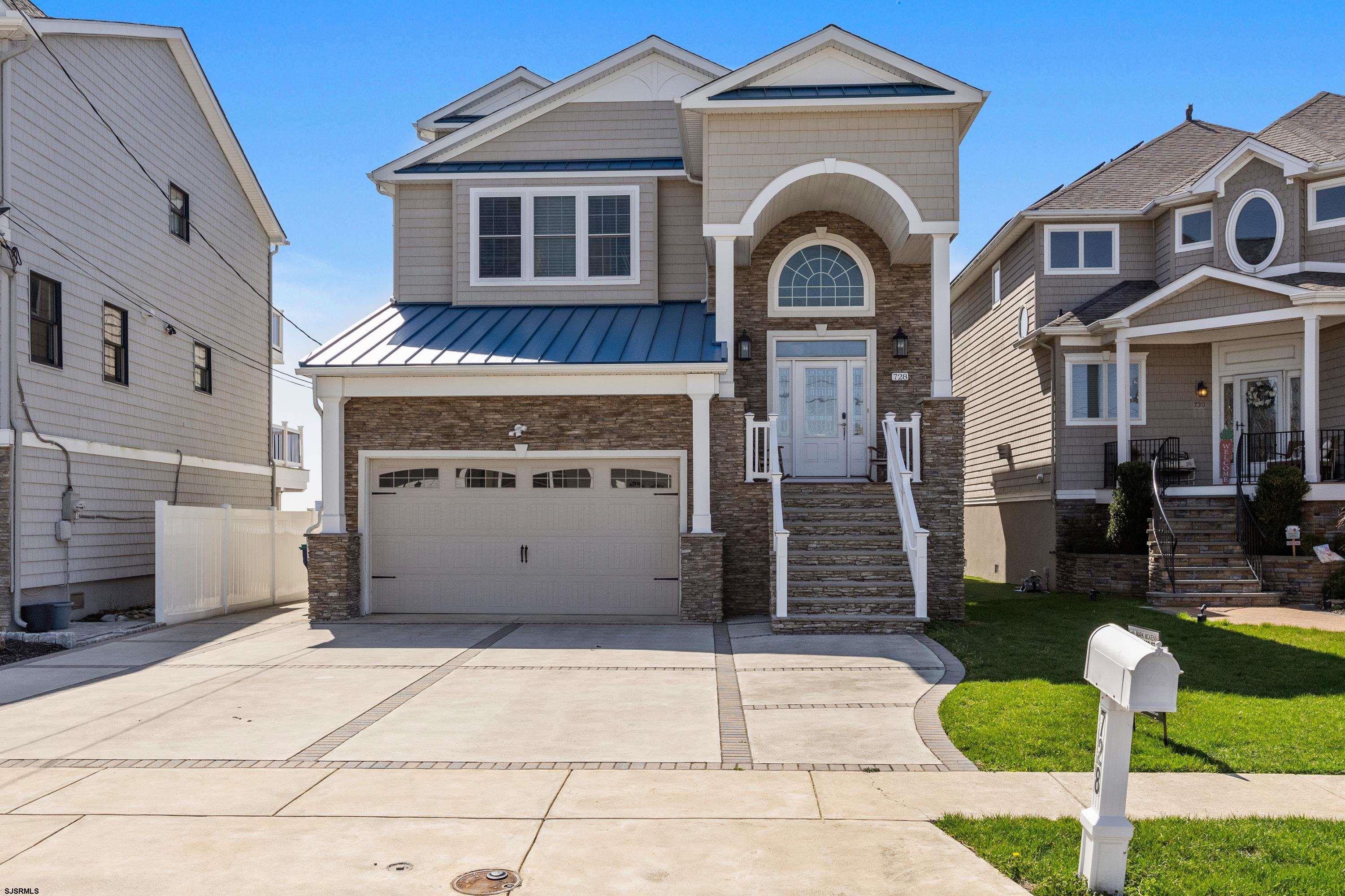A stunning 4-bedroom, 4.5-bath home on the bay in Brigantine, NJ, offering breathtaking views and exceptional features. With a sophisticated neutral interior and a striking custom stone fireplace, this home seamlessly blends luxury and comfort. Enjoy panoramic bay views from nearly every room, creating a tranquil and serene atmosphere perfect for your shore days. On clear nights, relish the picturesque sights of Atlantic City across the bay, with its vibrant entertainment and fine dining just a short distance away. As you enter this remarkable home, you’re greeted by a bright and airy open floor plan that encompasses the living room, dining room, kitchen, half bath, and access to a spacious deck. The kitchen is a chef’s dream, featuring ample cabinetry, sleek stainless steel appliances, and plenty of counter space. The custom stone fireplace serves as a stunning focal point in the living room. Upstairs, across two additional levels, you’ll find all four generously sized bedrooms and four full bathrooms, each offering walk-in closets and abundant natural light to wake you gently in the morning. Additionally, there’s a second living room with a wet bar, leading out to yet another expansive deck, perfect for outdoor entertaining. For your convenience and ease, the home is also equipped with an elevator. This exceptional residence offers a perfect blend of luxury, peaceful vibes, and effortless comfort. Live the ultimate shore lifestyle in this dream home on the bay. Schedule your private showing today!