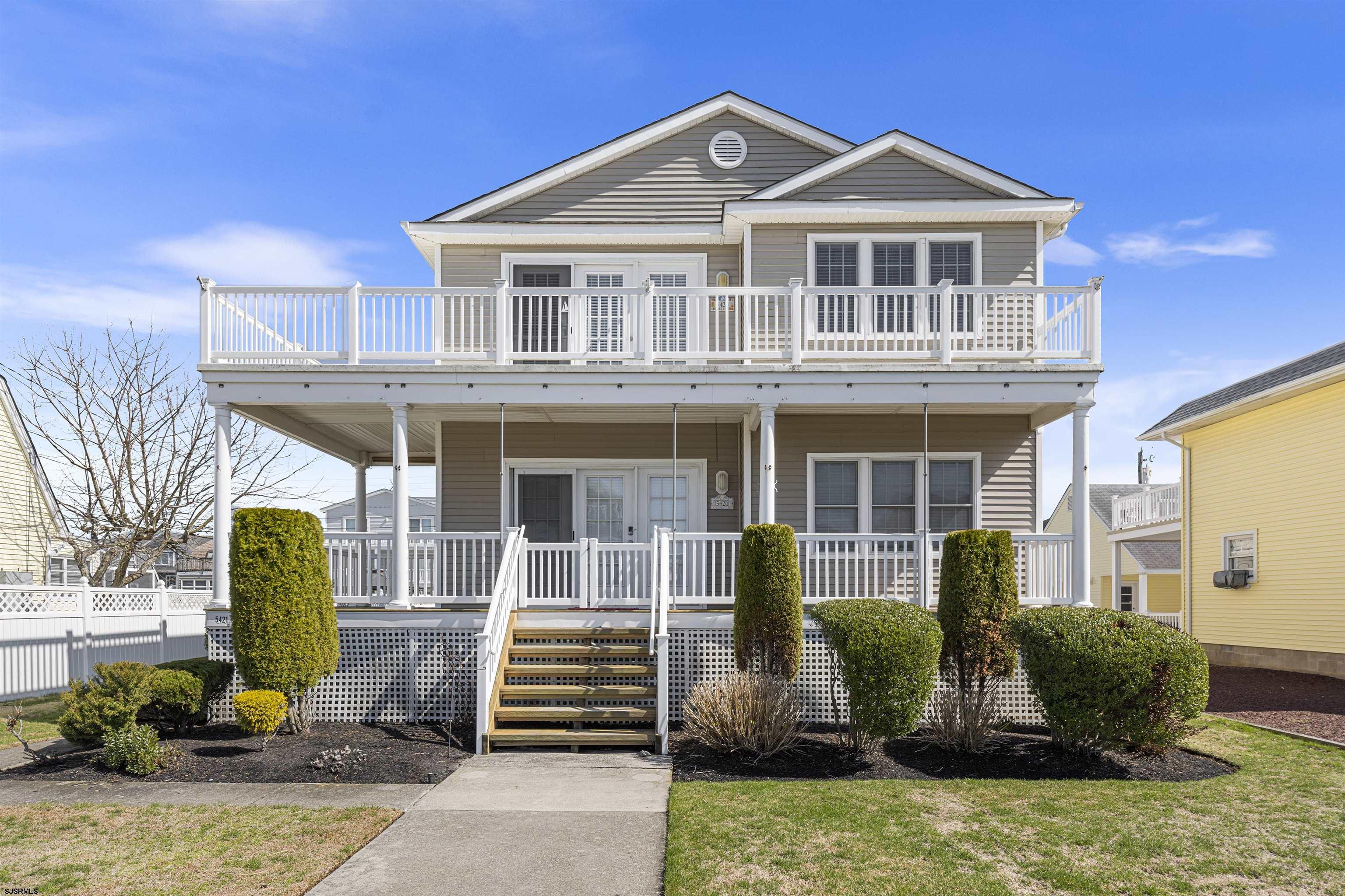 Welcome to your dream shore retreat in Ocean City! This stunning second-floor 4-bedroom, 2-bath condo sits on an oversized 55’ x 115’ lot—offering more space, more privacy, and more value than most 4-bedroom condos in the area (which typically sit on 40' x 100' lots). You’ll instantly feel the difference in the expansive side yard, perfect for relaxing evenings and quiet mornings on your wraparound front deck or the private rooftop deck.  Inside, you’re greeted by vaulted ceilings in the great room, a large center island kitchen, and generous closet space throughout. Bonus features include a private enclosed outdoor shower, full-size laundry, attic storage, and a garage with an additional storage room—ideal for all your beach gear.  Nestled in a quiet neighborhood on a low-traffic street, this home offers plenty of parking and is within easy walking distance to the beach, restaurants, and ice cream. Just a short drive to Corson’s Inlet State Park, Strathmere, Sea Isle dining, and the iconic Ocean City Boardwalk.  Whether you're looking for a second home, a vacation rental, or a place to make lasting memories, this one checks all the boxes.