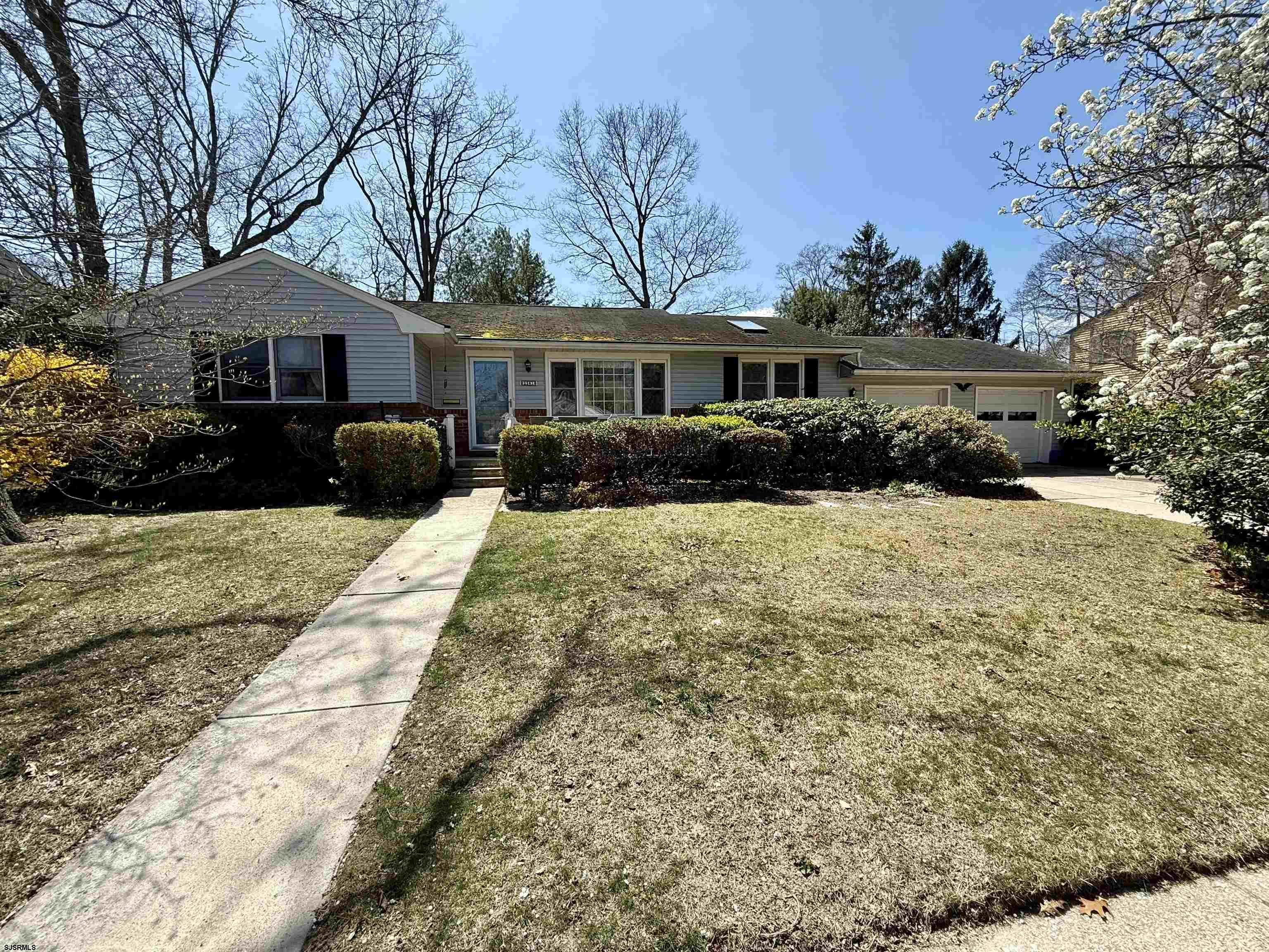 HIGHEST and BEST due by tuesday 4/15 at 1pm.  Nestled in one of Northfield’s most sought-after neighborhoods and just minutes from top-rated local schools, this expanded ranch offers a rare opportunity to create your dream home in the heart of northfield. The centrally located property features great front porch, three full bedrooms, two full bathrooms and a spacious layout designed for comfortable living. Whether you're looking to move right in or personalize every detail, this home is brimming with opportunity.   Inside you'll find an eat in kitchen, a large living room, and a bonus rec room – ideal for relaxing or entertaining. The highlight is the charming back room, complete with a fireplace, built-in shelving, and a beautiful view of the large, nearly fully fenced and private backyard. Step outside to enjoy the oversize deck, perfect for outdoor gatheringsStep out onto the oversized deck, ideal for outdoor hangouts. Other features include a two-car garage (currently a workshop, storage and play area but could easily be converted back!), hardwood floors under the carpet, and some newer windows. it’s a terrific layout in a fantastic location- this home is filled with potential and ready for your personal touches.