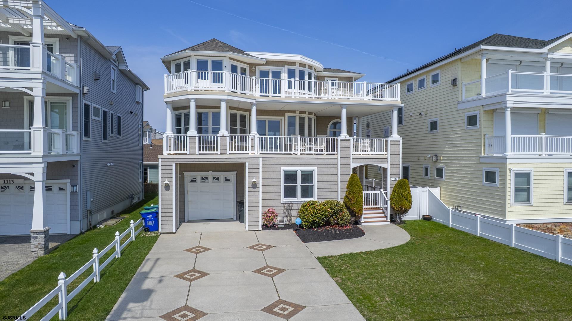 Introducing an unparalleled beachfront haven in the exclusive A zone of Brigantine, NJ—a luxurious property built for oceanfront enthusiasts. Revel in the stunning open great room that frames unobstructed, 180° panoramic ocean views, offering a daily escape to the serene seaside. The heart of this beach home is complete with a state-of-the-art kitchen, complete with a glamorous center island, granite countertops, stainless steel appliances, including a wine refrigerator, stylish tile backsplash, and high quality cabinetry—perfect for the gourmet chef. An expansive living area surrounds this culinary masterpiece, complete with lux vinyl flooring seamlessly connecting to an additional family room, and massive outdoor shaded ocean view deck that capture the boundless beauty of the beachfront. Accommodating your every need, this residence boasts 4 large bedrooms + an additional room for your home office complete with a built in bar or potential 5th bedroom, and 5.5 modern baths, featuring the likes of elegant tile, glass, and exquisite vanities, ensuring comfort and sophistication throughout every detail. Additional features include dual-zone central air and gas heat for year-round comfort, durable cedar shake vinyl siding with refined porch rails, and sweeping, oversized top floor deck that invite leisurely mornings and magical evenings beside the ocean. The property also offers a large 2 car deep garage offering ample storage, a convenient enclosed outdoor shower for rinsing off after beach days, and a sprawling backyard that provides endless potential for a luxurious pool or outdoor entertainment oasis. Embrace the coastal lifestyle in this exceptional Brigantine gem—a perfect blend of luxury, comfort, and breathtaking coastal views.