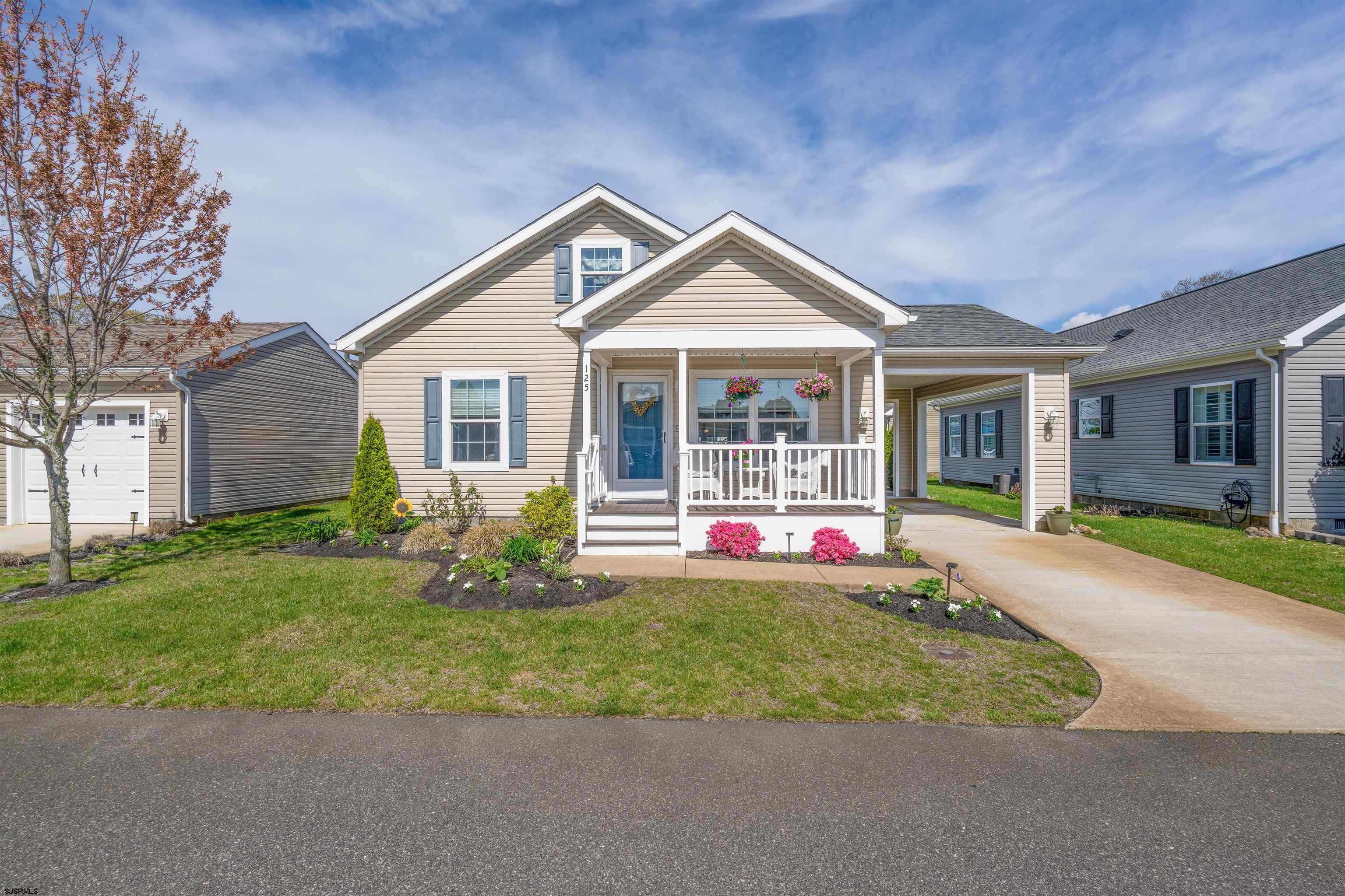 OPEN HOUSE: Saturday, May 10th: 10am-1pm and Sunday, May 11th: 12pm-3pm. Located in the highly sought-after 55+ community of Osprey Cove! This beautiful home sits in Upper Township, just minutes from the beaches of Ocean City, Sea Isle City, and Avalon. The front of the home features a fabulous porch offering tranquility as you step through the full glass storm door into a sunshine-filled spacious living room. Elegant crown molding adorns each room. This “Sea Isle” model, open floor plan leads to a bright white kitchen featuring two breakfast bar areas accommodating 4-6 barstools combined, complete stainless steel appliance package (refrigerator and microwave less than one year old), convenient 42-inch cabinets for all your storage needs, soft-close drawers, upgraded faucets, and six high hat light fixtures.  Enjoy family meals in the sunny dining area where a sliding glass door opens to your outdoor patio—perfect for sipping morning coffee or evening drinks in the refreshing summer breeze by the shore in addition to the front porch area. The master bedroom offers plenty of space with a large closet, new ceiling fan, private bathroom featuring double sinks. Your guests will feel right at home in the roomy second bedroom with a new ceiling fan and closet space near the hallway bathroom. Stay organized with the laundry room's extra cabinets and storage closets.  Osprey Cove gives you so much more than just a beautiful home- Community features include a welcoming clubhouse with an in-ground pool & patio lounging area, gathering room, kitchen, TV, and fireplace, fun game room with pool table, card room for social gatherings, exercise room to stay active, cozy library corner, scenic walking paths, and a special dog walking area.  Community fees cover everything from taxes and landscaping to snow removal and trash pickup, making life carefree! Make your next home at the Cove and join this vibrant 55+ community.