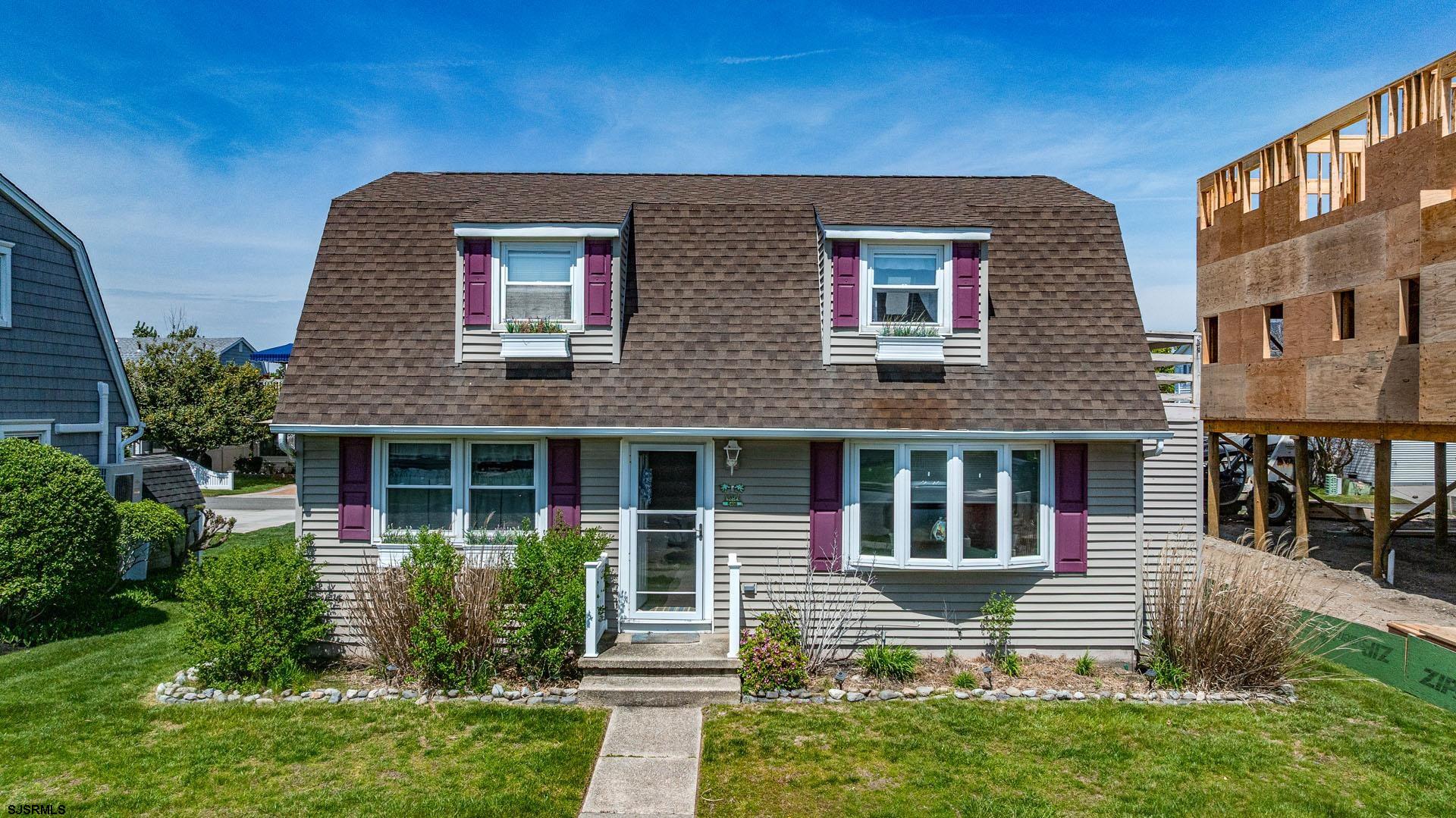 Nestled just minutes from the BEACH in vibrant Ocean City, this CHARMING 4-bedroom, 2-bathroom home offers the PERFECT blend of modern UPGRADES and coastal convenience. Enter to find a light-filled living room, an amazing spot for everyone to gather. The remodeled kitchen BOASTS stainless steel appliances, granite countertops, a STYLISH tile backsplash, and tile flooring. TWO bright bedrooms share an updated bathroom with a large, all-tile walk-in shower. A sliding door from the kitchen leads to a VERSATILE Florida room surrounded by windows, a backyard view, and access to the HUGE deck. The utility room adjoins this space for added convenience. A separate entrance leads to a self-contained UPSTAIRS unit with two bedrooms, a full bath, and a combined living room/kitchen area, perfect for guests or rental potential. With newer windows, outdoor shower, two electric meters, a single gas meter, a storage shed, and partial furniture, this home is as PRACTICAL as it is INVITING. Situated in a FANTASTIC location with quick access to island restaurants, shopping, and a short drive to the ICONIC Ocean City Boardwalk, this COASTAL retreat is your ticket to year-round living, vacation bliss, or investment opportunity. Seize your slice of PARADISE!