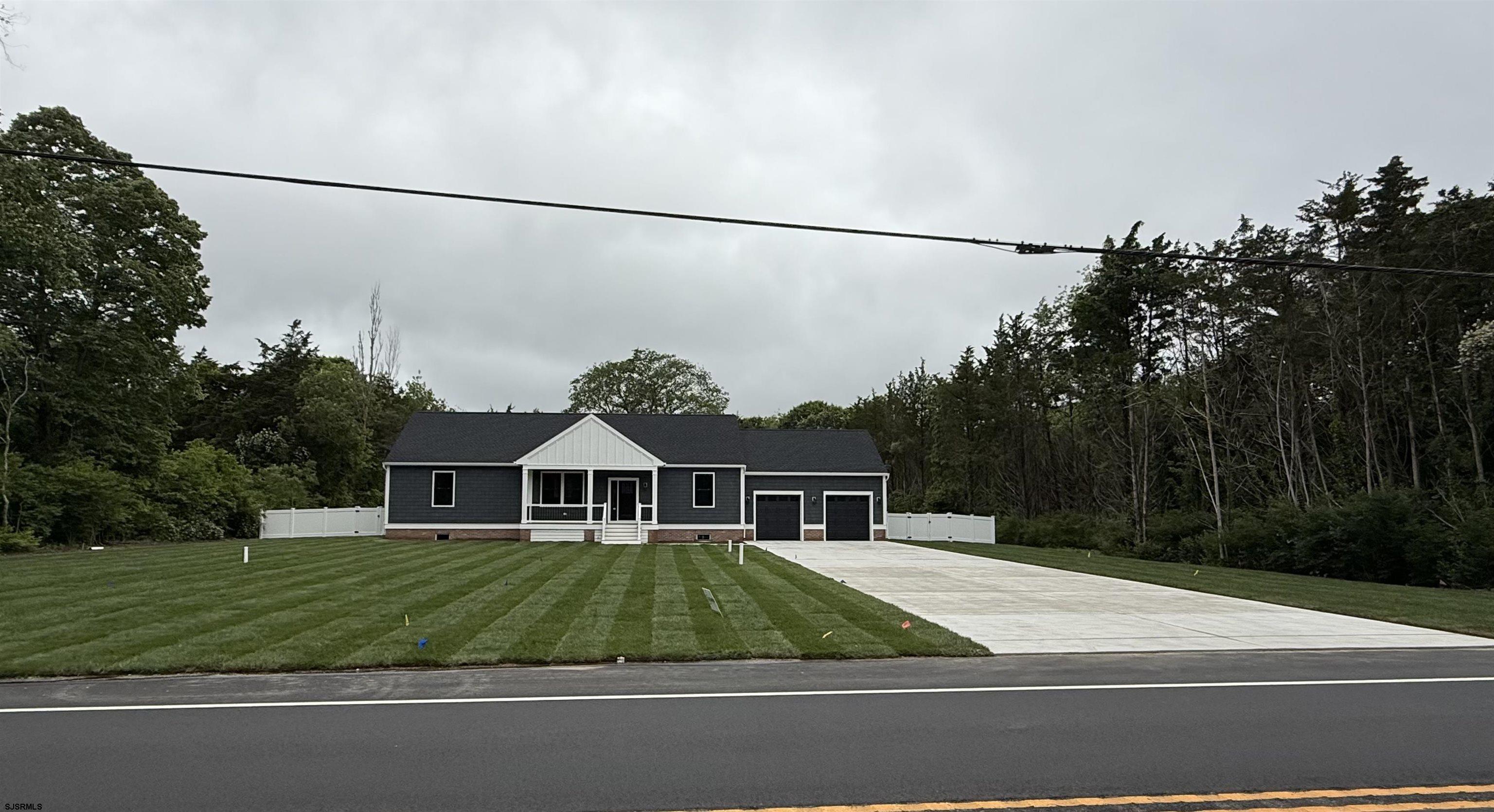 OPEN HOUSE SATURDAY 5/10 12:00-2:00PM. **FRONT YARD WILL BE FULLY SODDED**  Just Completed! This beautifully crafted new construction home in Upper Township is equipped with custom finishes from top to bottom and spans over 3,000 sq ft. Featuring 3 bedrooms, 2 full bathrooms, and a massive finished basement that spans the entire length of the home—perfect for a second living area, home gym, or entertainment space.      Step outside and enjoy the best of indoor-outdoor living with a covered front deck and a spacious back deck, ideal for morning coffee, outdoor dining, or entertaining guests. The home also includes a huge laundry room and an attached 2 car garage, offering tons of functionality and storage.    Set on a full acre of land, the private, fenced-in backyard features a sprinkler system and plenty of room to add a pool, firepit, or garden.    Located in the Upper Township School District and the Ocean City High School sending district, and just a short drive to the beaches of Ocean City, Avalon, and Sea Isle City—this home checks all the boxes for full-time living or a serene coastal retreat.    Don’t miss your chance to own a custom-built home in one of Cape May County’s most desirable communities! Please note: Backyard will be seeded, master shower to be fitted with glass door.