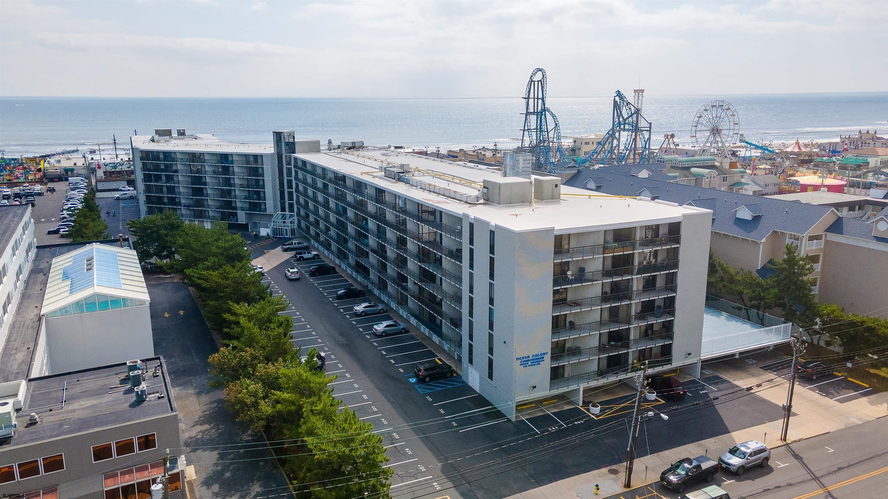 Welcome to Ocean Colony - one of Ocean City's most desirable beachfront communities- where this updated 3 bedroom, 2 bath condo offers generous living space, thoughtful upgrades, and a prime location just steps from the boardwalk and beach. Unit #315 features the largest private deck in the complex, overlooking the pool. Accessible from the living room, primary suite, and both additional bedrooms, the deck is partially covered-offering the option to relax in the shade or soak up the sun. The outdoor carpeting was replaced just two years ago to keep the space clean and well-maintained.  Inside, the condo boasts updated flooring, new light fixtures, refreshed bathrooms, and recently installed window treatments and blinds. The living room and kitchen offer plenty of room for everyday living and entertaining, while multiple closets throughout provide ample storage.  The expansive primary suite includes a smaller private deck, two walk-in closets, an ensuite, and an extended vanity with plenty of counter space. Two additional well-sized bedrooms offer versatility- ideal for guests, kids, or a home office.  Ocean Colony offers a wide range of amenities including a heated pool, pickleball, basketball and shuffleboard courts, a fitness center with sauna, game room, community room, elevators, security, and onsite management.  Sold furnished and move-in ready, this condo includes an assigned parking space, private storage locker, and a location that makes everyday life- or weekend escapes- effortless by the beach.